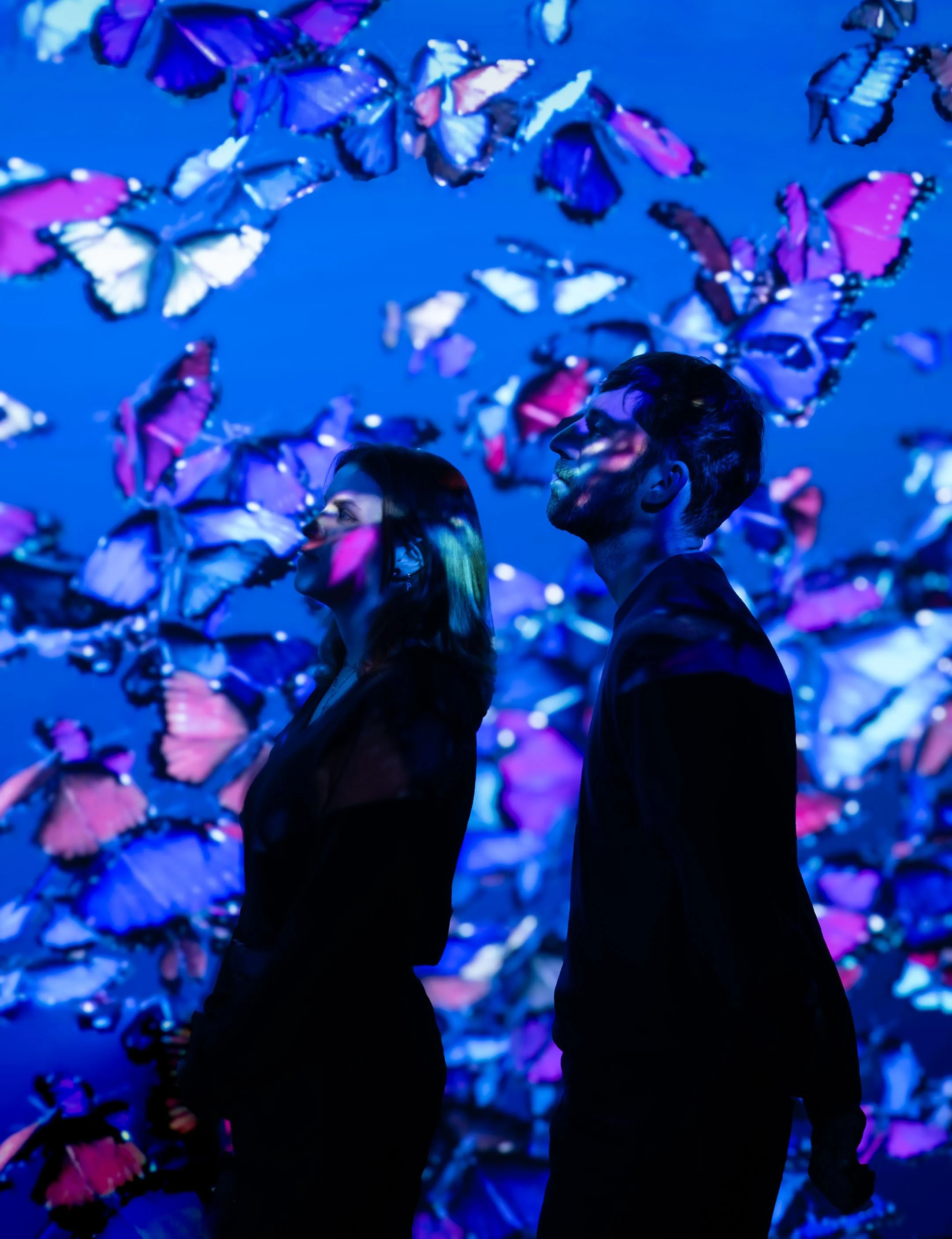 National Portrait Gallery UNFRAMED  , exhibition created by Frameless.  Models looking at immersive projections  , photo © Antonio Pagano