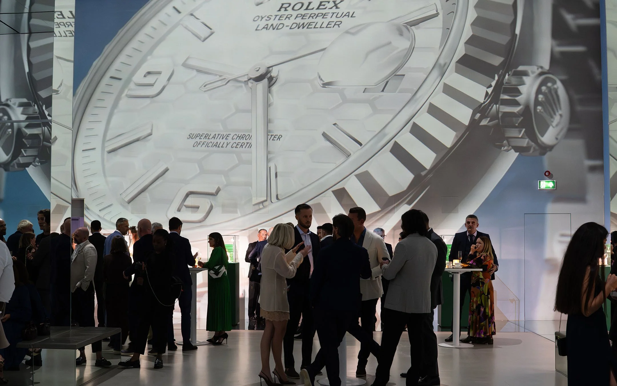 Rolex launch & gala dinner by DMR (David M Robinson-Jewellery & Watches) at Frameless immersive museum, London. The background features the oversized  Rolex Oyster Perpetual Land-Dweller