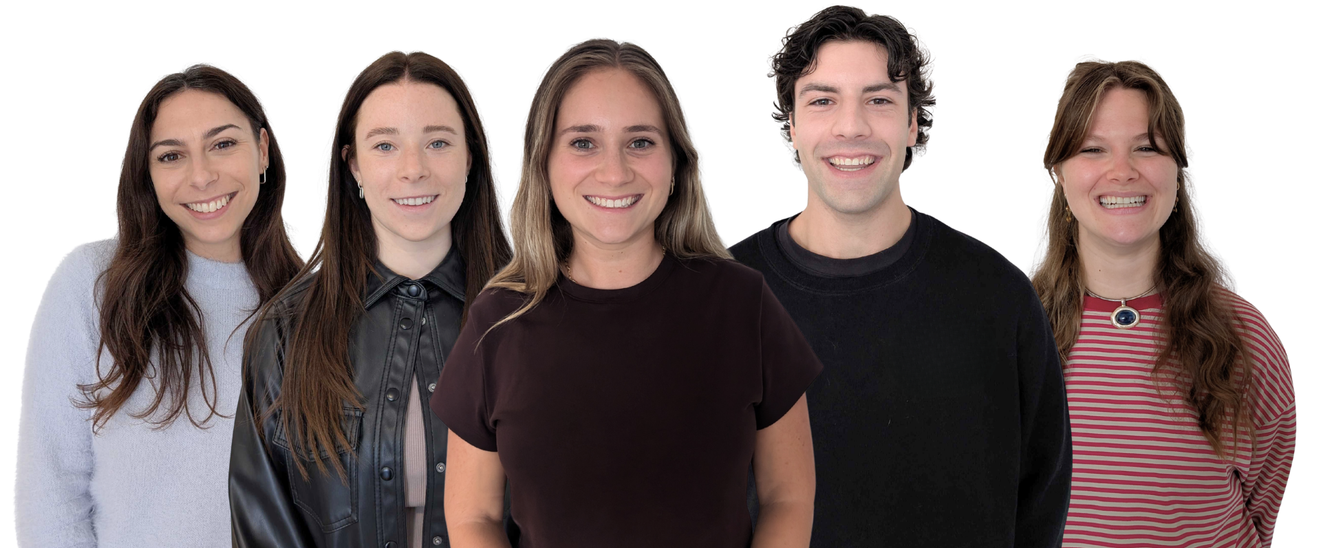 Group portrait of five young adults, four women and one man, smiling and standing close together, against a plain background.