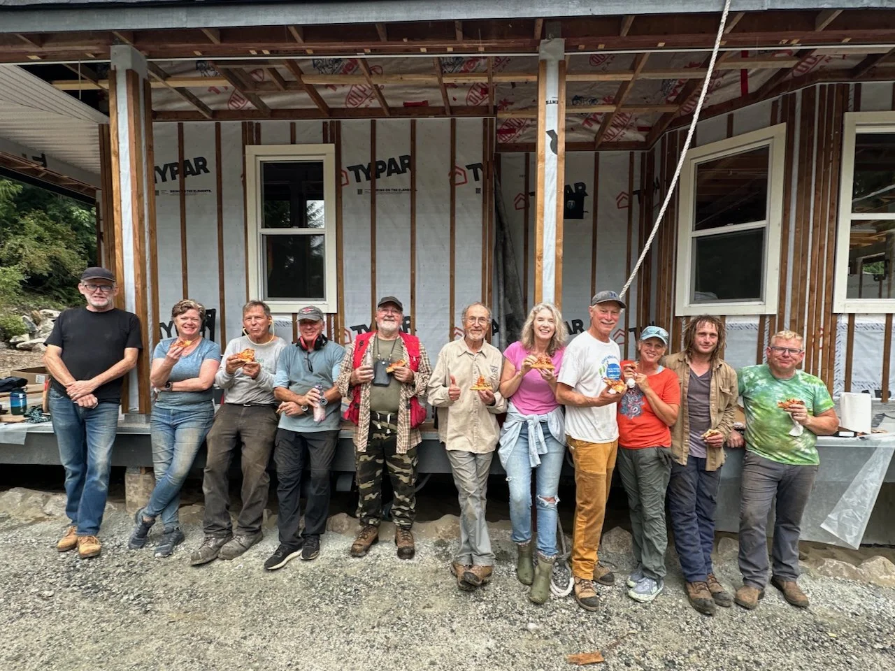 Volunteers stop for a pizza lunch after gardening 