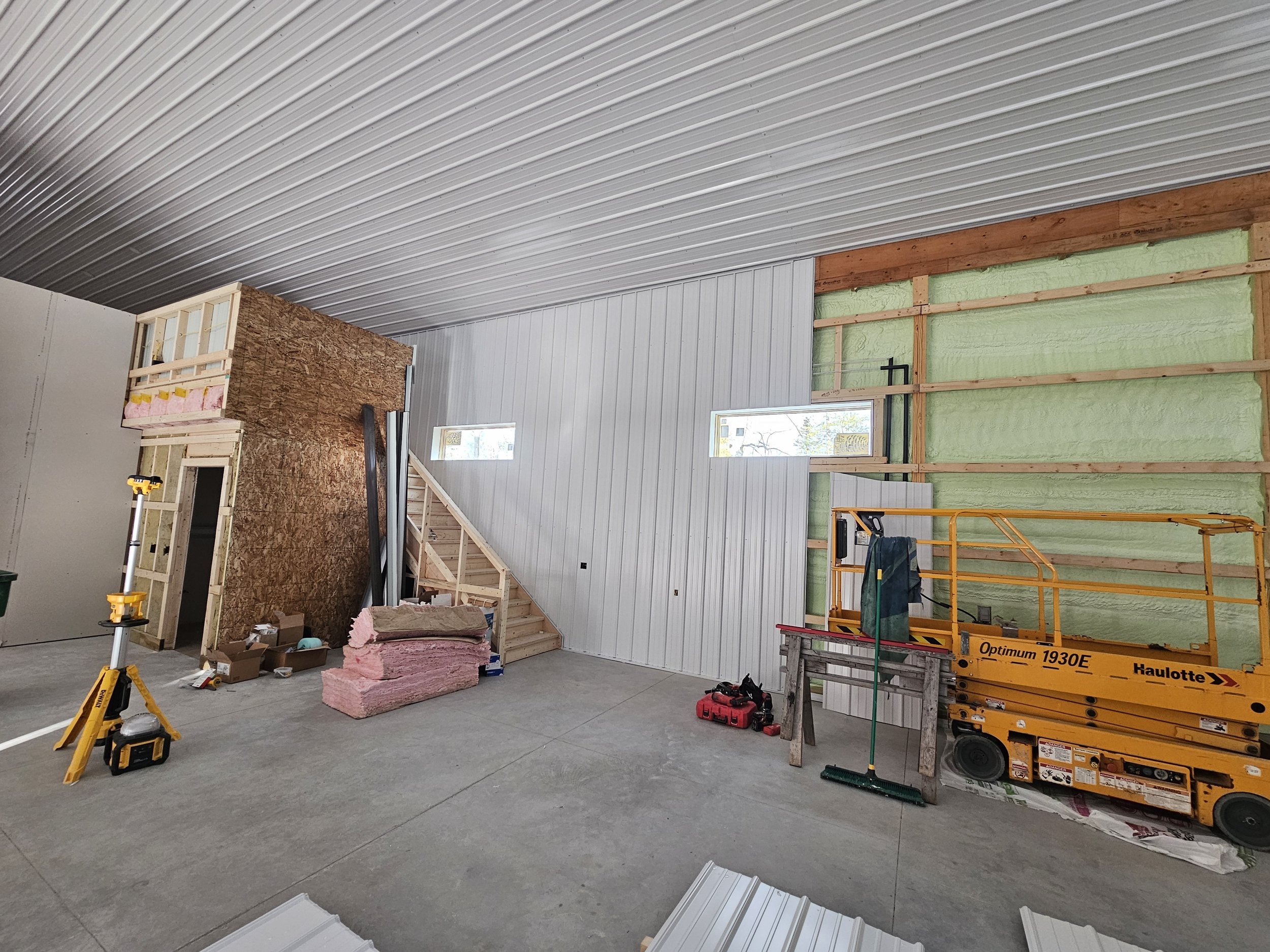 On this particular project I am helping support a local builder. Here we are hanging interior liner steel on this big barn dominium. 