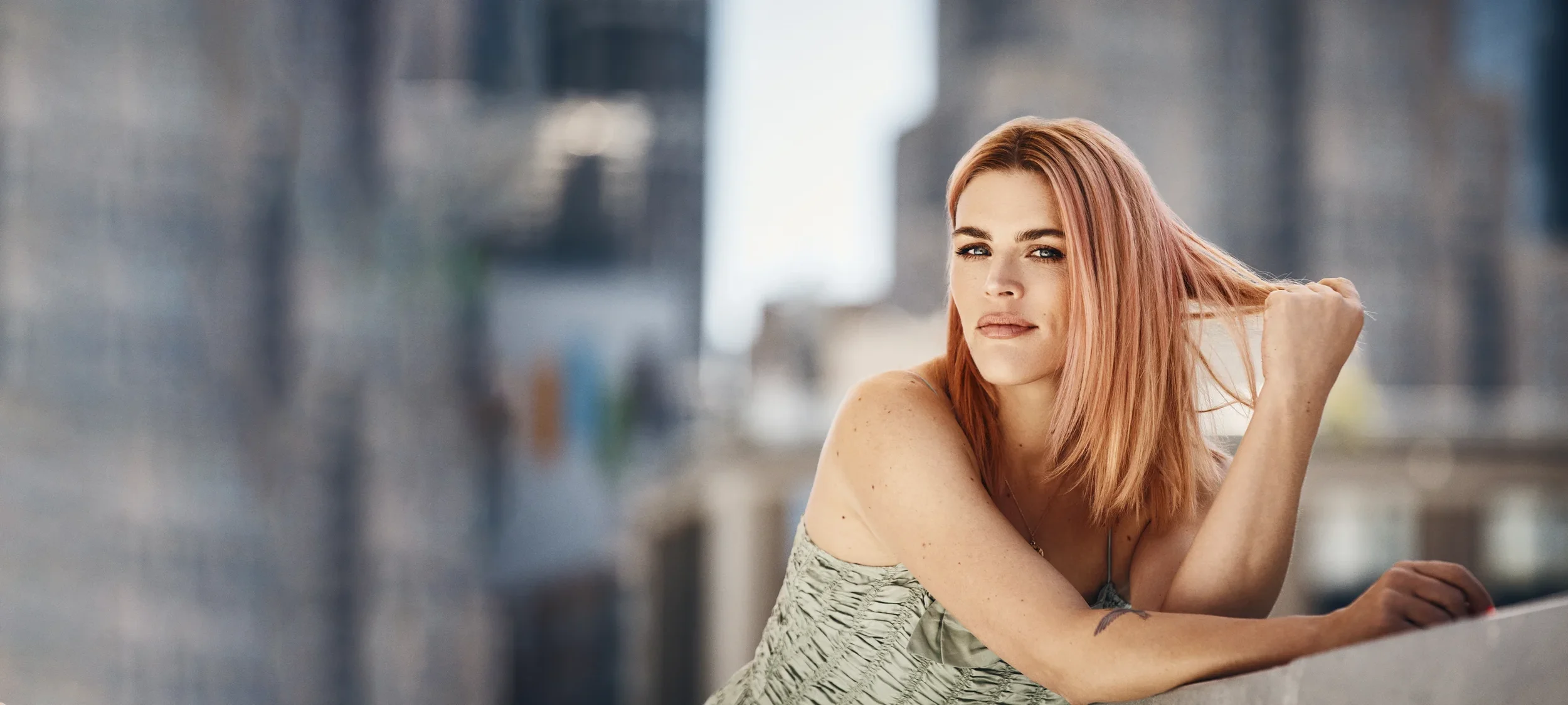 Busy Philipps posing for FlowSpace