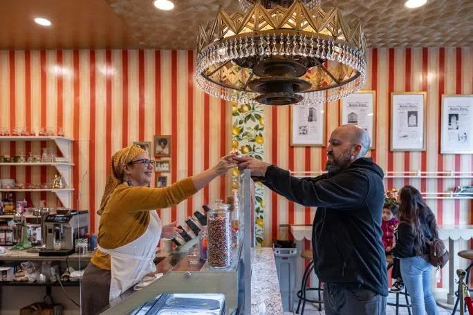 BB'S Gelateria owner Stacy Williams serves gelato with a smile