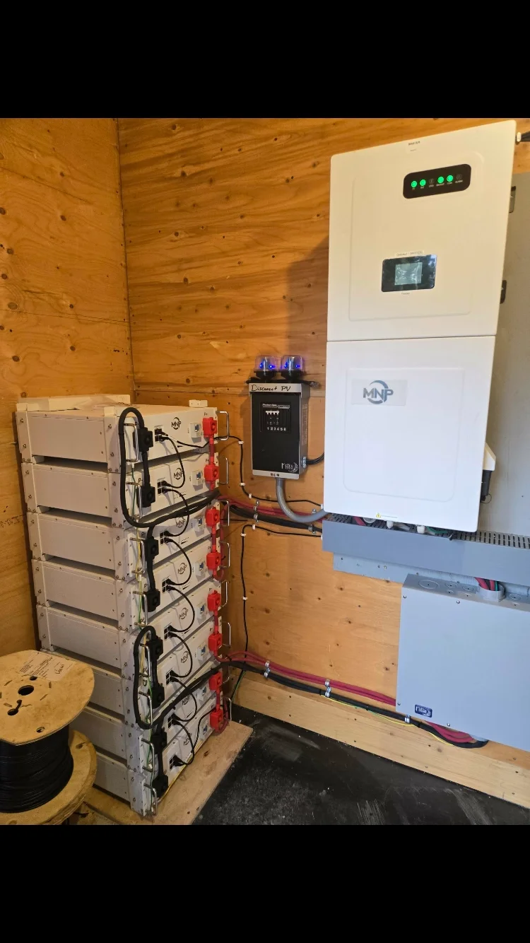 MidNite inverter with stacked lithium batteries indoors