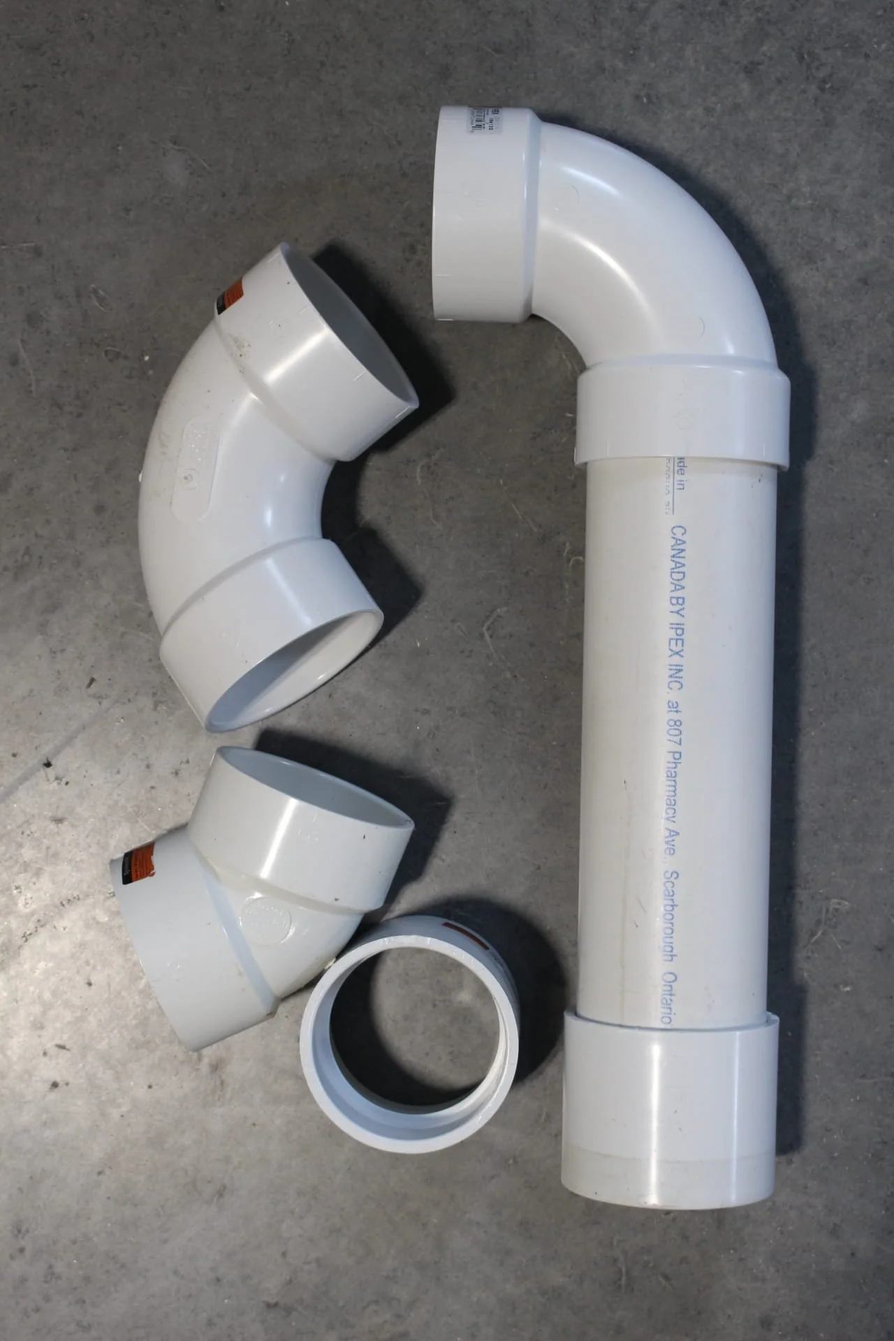 PVC elbow fitting for water heater venting