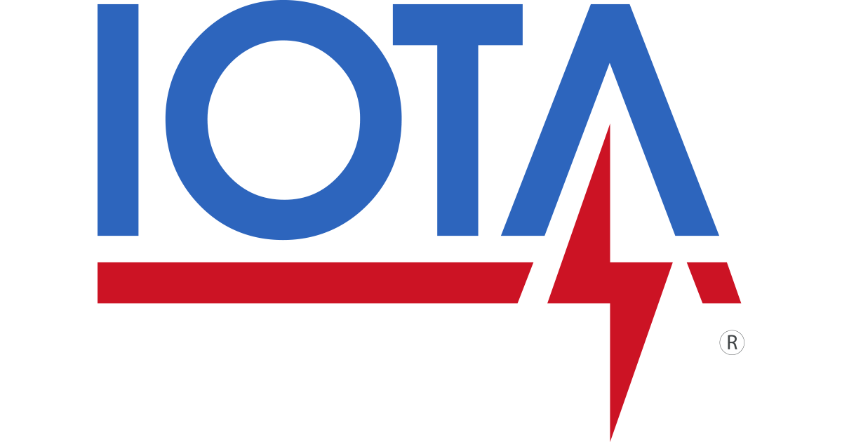 Logo of IOTA, a political or organizational emblem with the name in blue, a red line underneath, and a red lightning bolt.