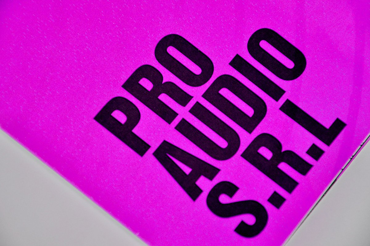 Close-up of a pink surface with the words 'PRO STUD' printed in bold black letters.