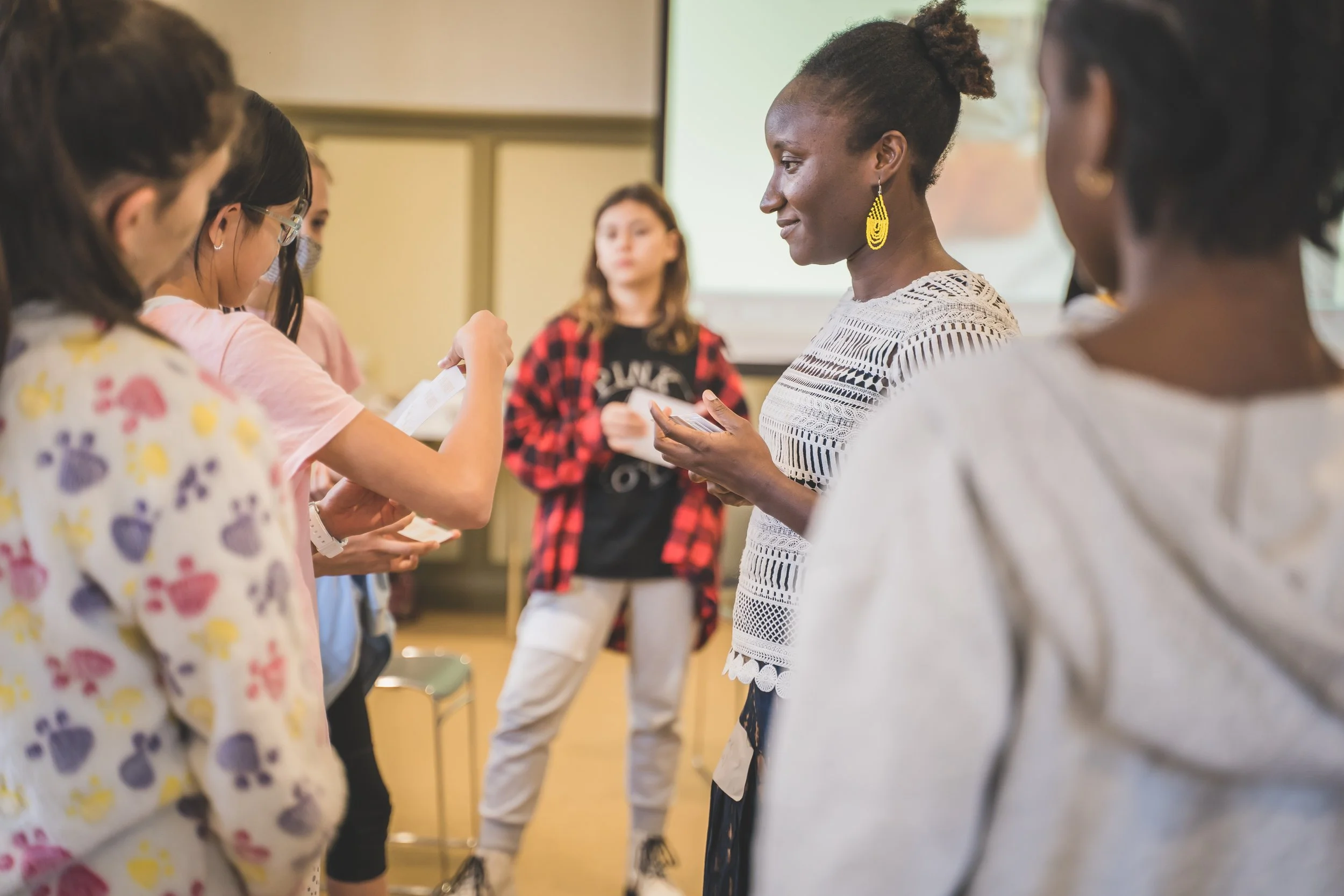 Hawa with some young people at a workshop, allowing an open space for young people to express themselves