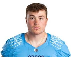 Portrait of a young man in a blue sports jersey