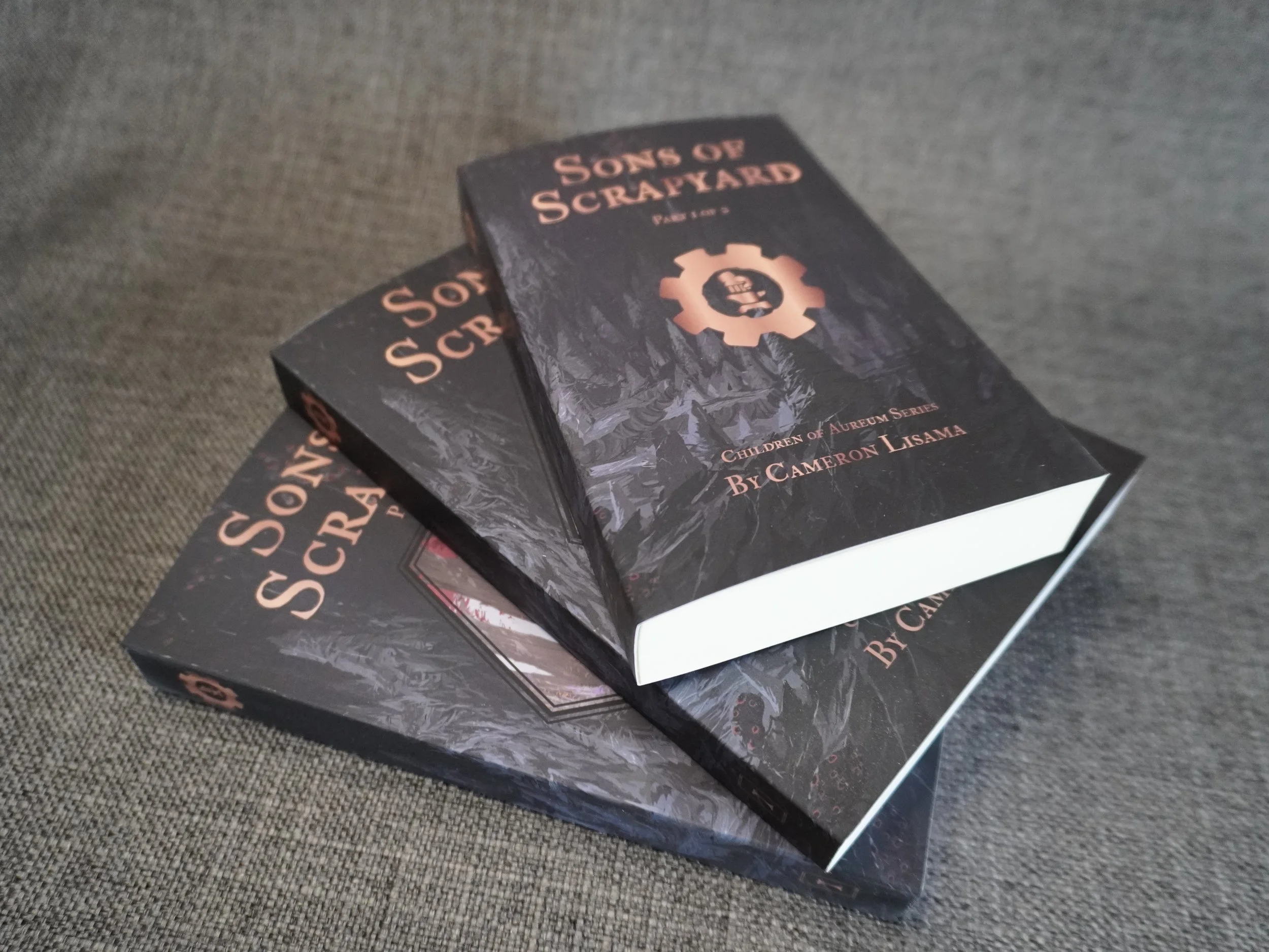 This is a product photo for the science fantasy action novel series, Sons of Scrapyard part 1 pocket edition, by Cameron Lisama.