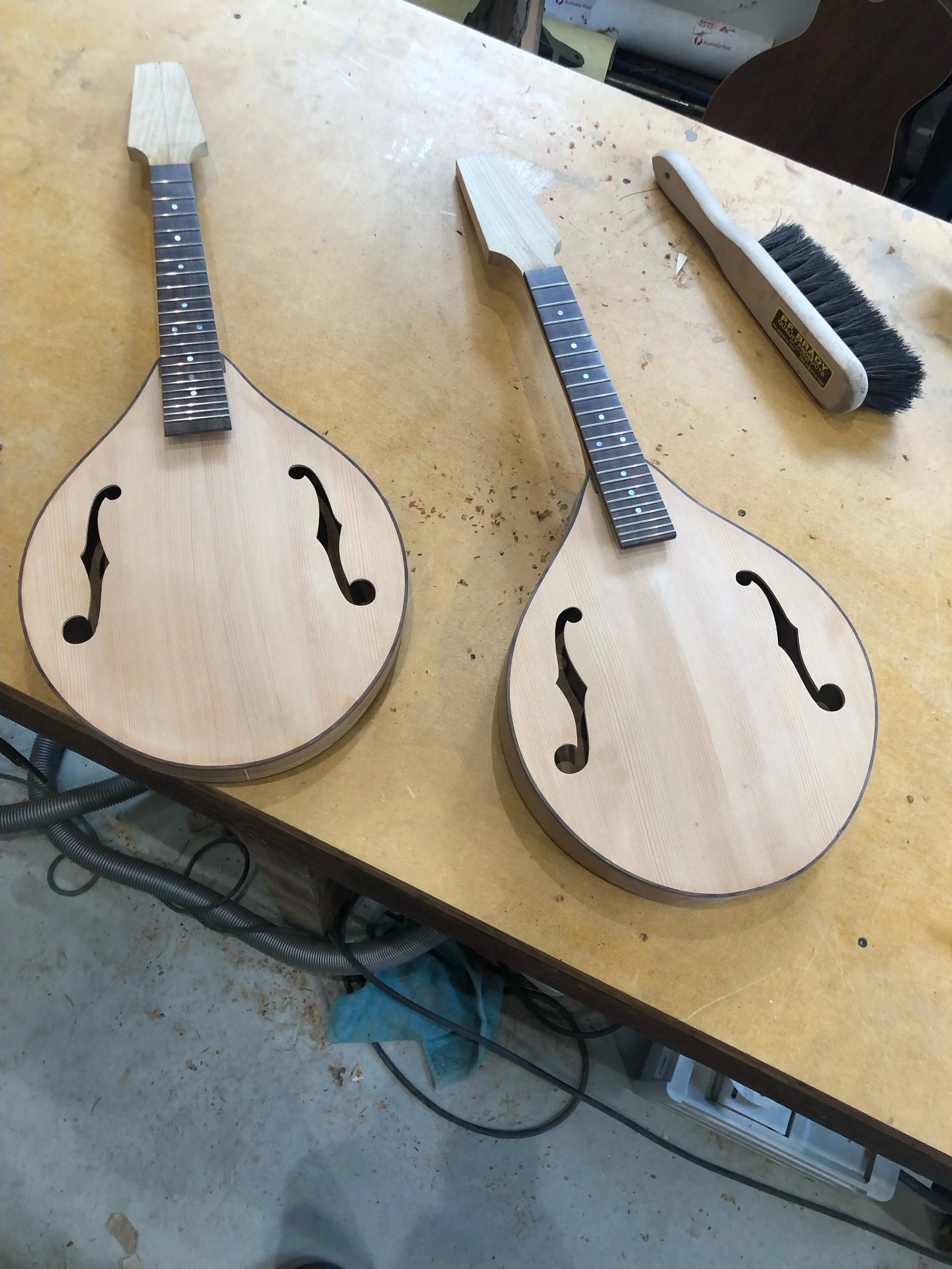 Two nearly complete mandolins with King Billy Pine top