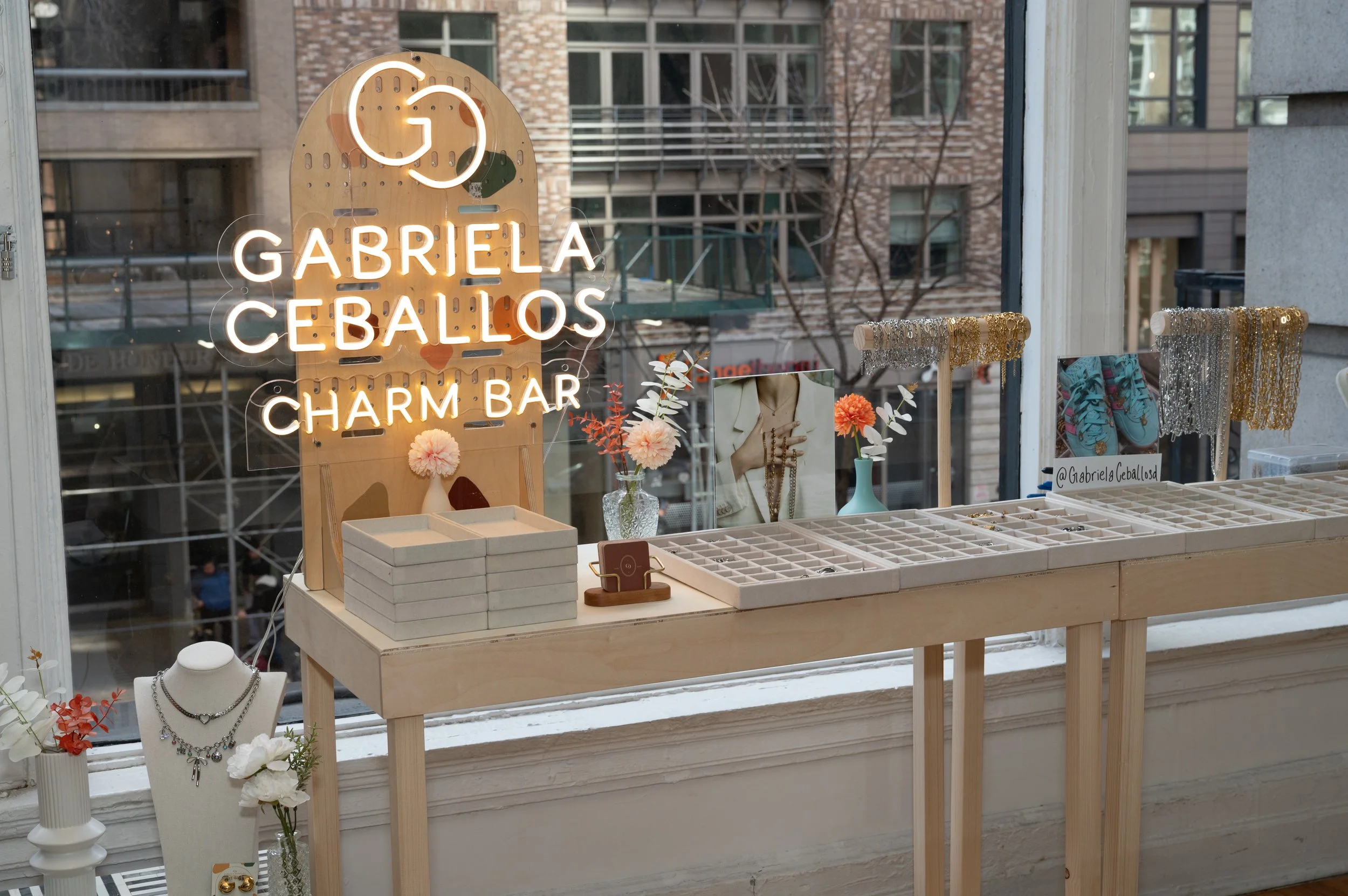 Secured a partnership with a local charm bar, Gabriela Ceballos, to provide influencers with a custom charm bracelet or necklace to take home.