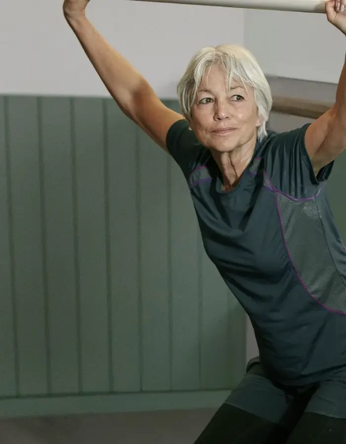 mature woman during strongHER clinical pilates class at Southside clinic in unless