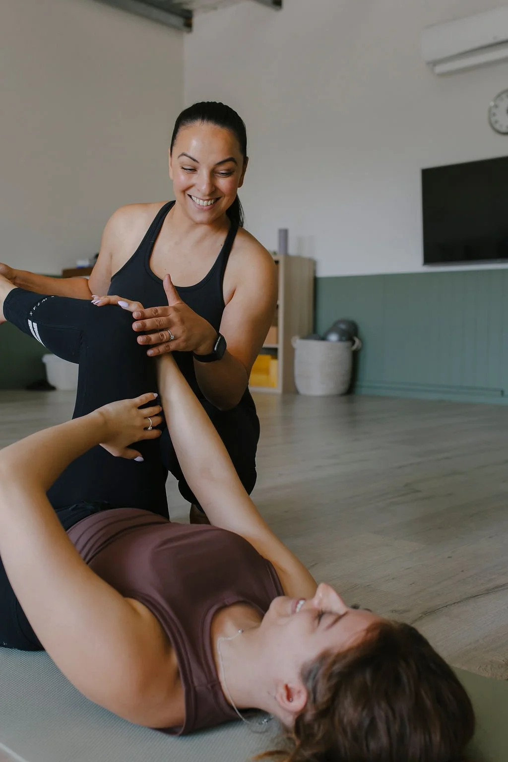 instructor helping during clinical pilates session at Southside Clinic Unley