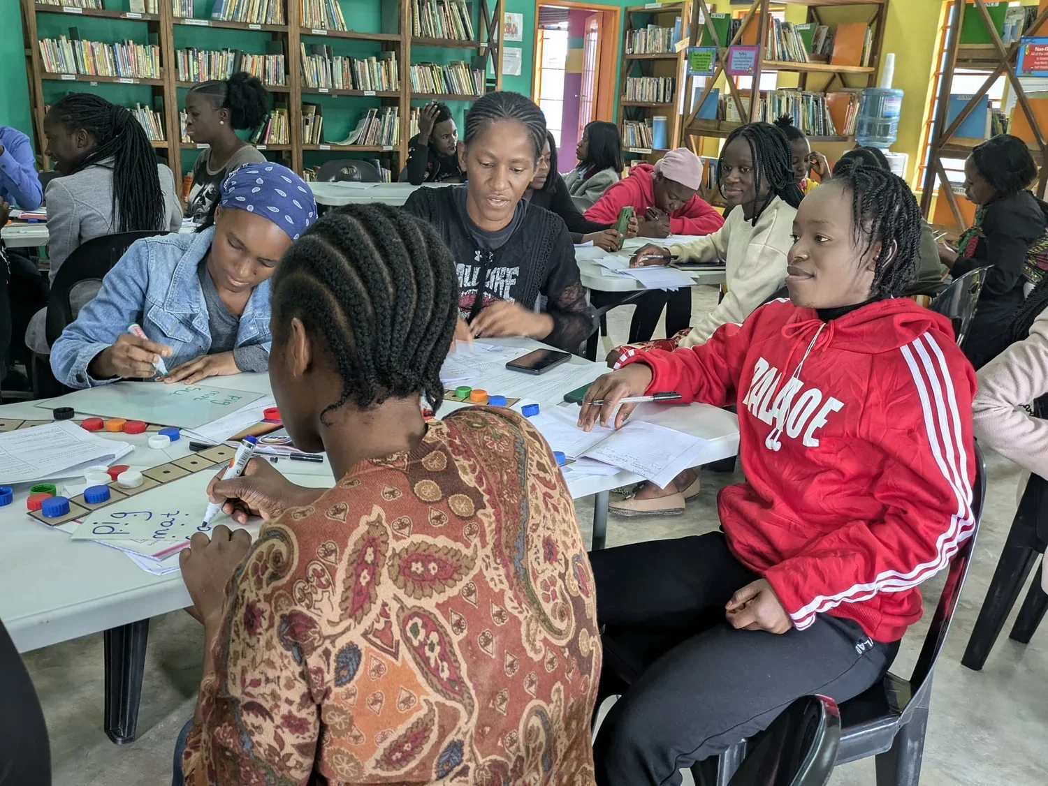 Teachers take part in modeling a lesson on letter formation
