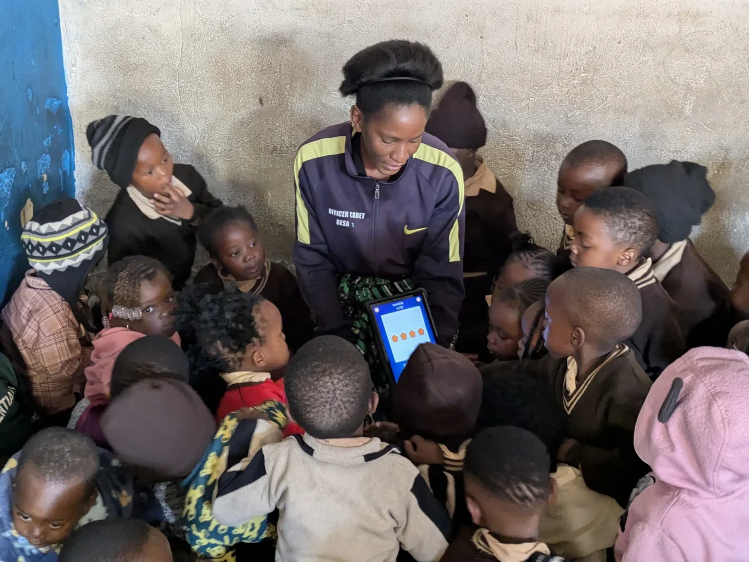 Sarah uses a tablet to teach counting