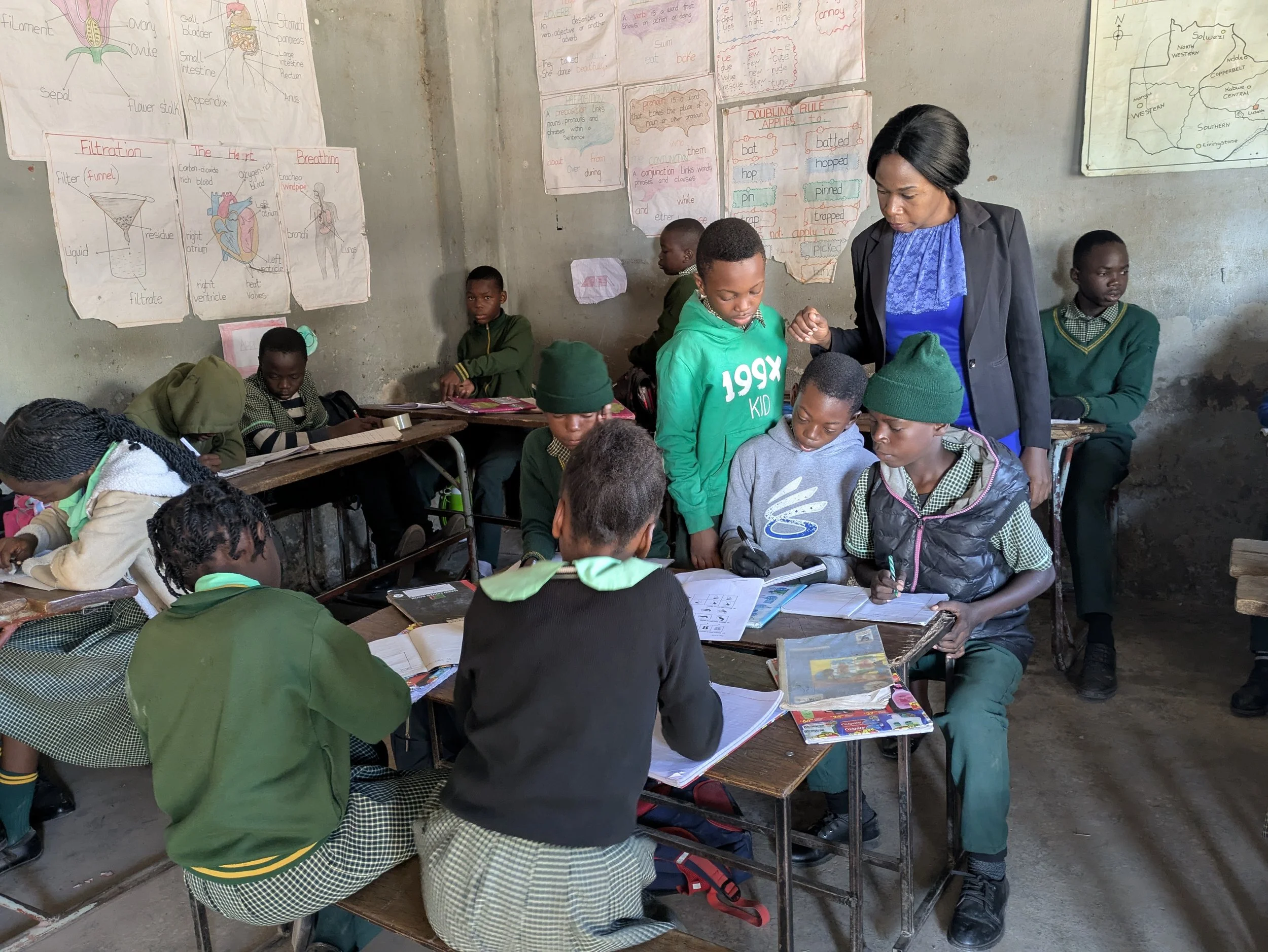 Amlucky facilitates group discussions in her class