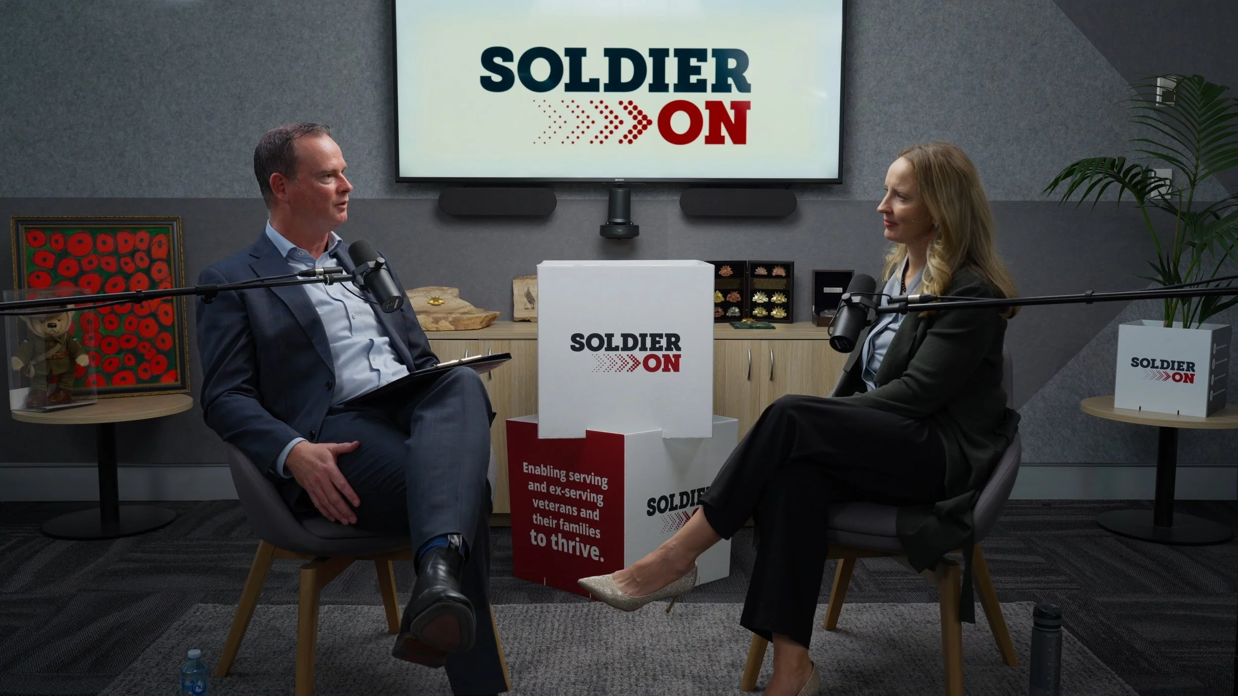 A wide angle shot from the set of a professional podcast.