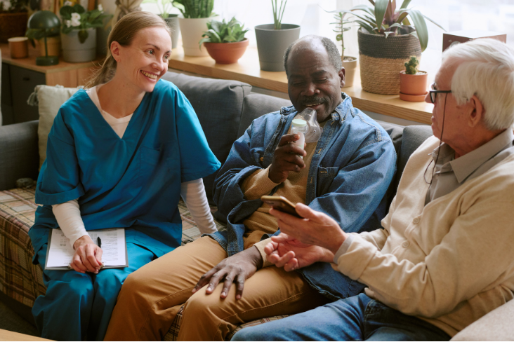 Nurse speaking with resident and family