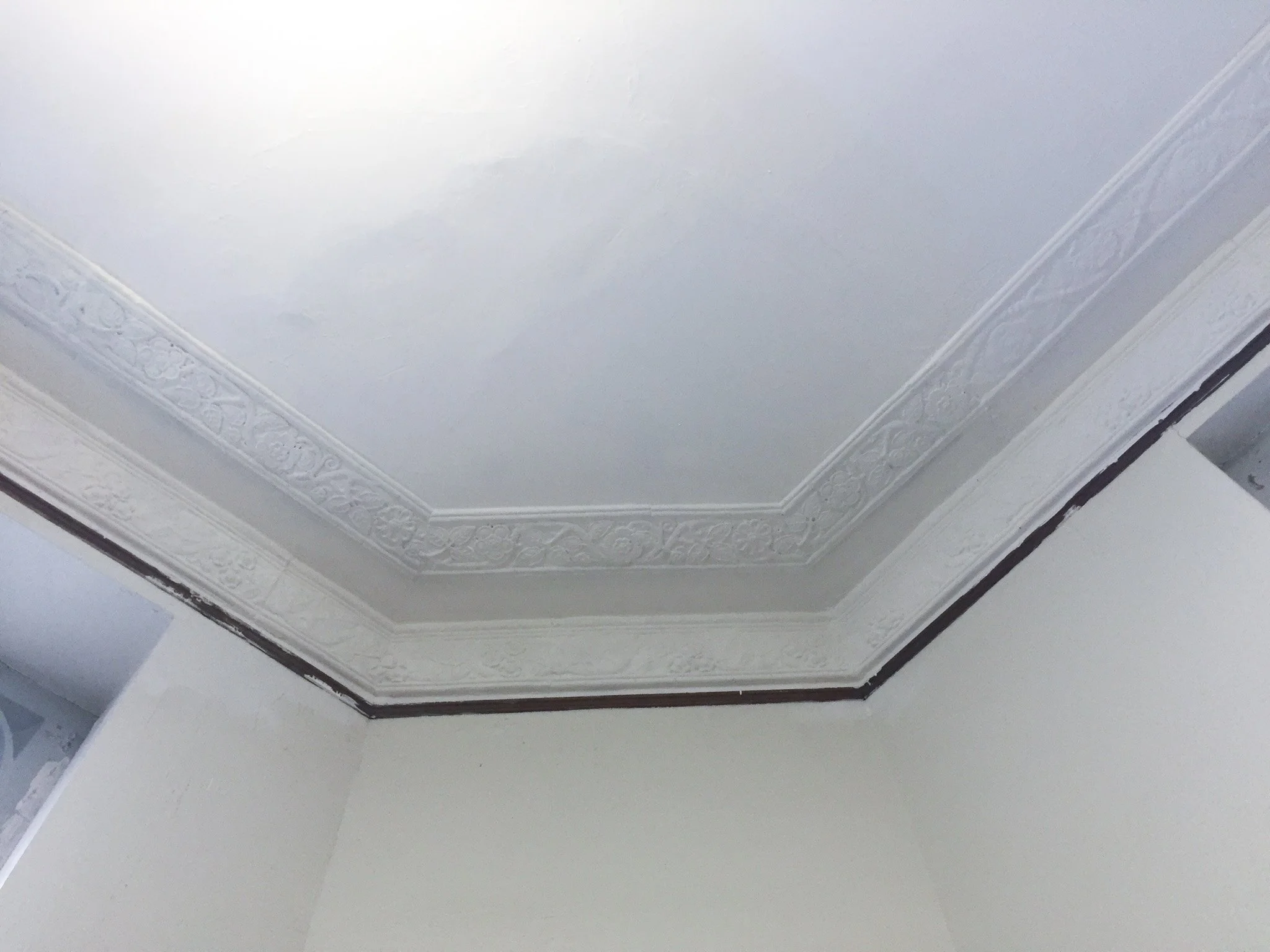 Fully repaired and finished plaster ceiling blended seamlessly after water damage