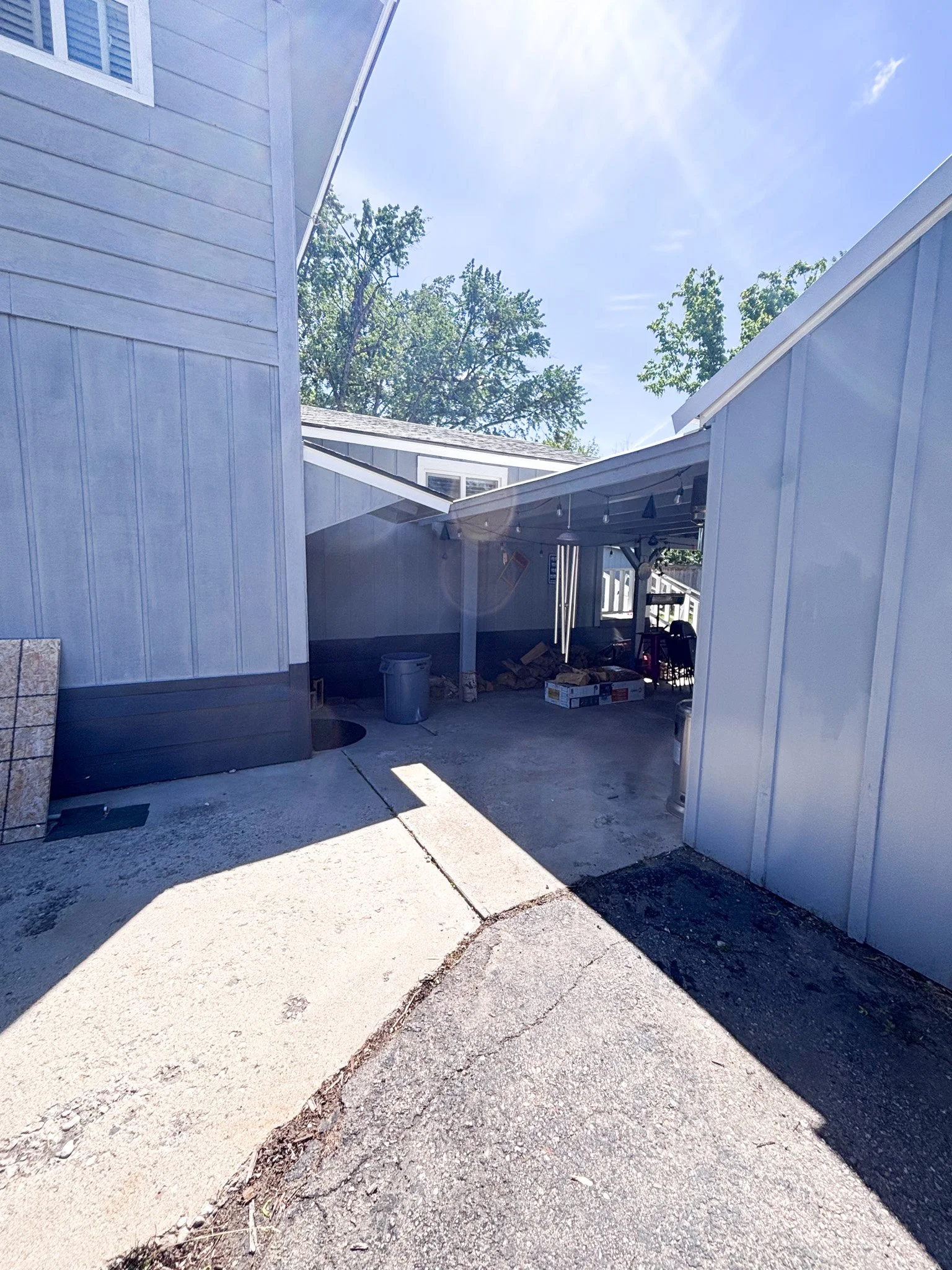 Image of Boise customer's driveway looking into their carport before the fence was installed