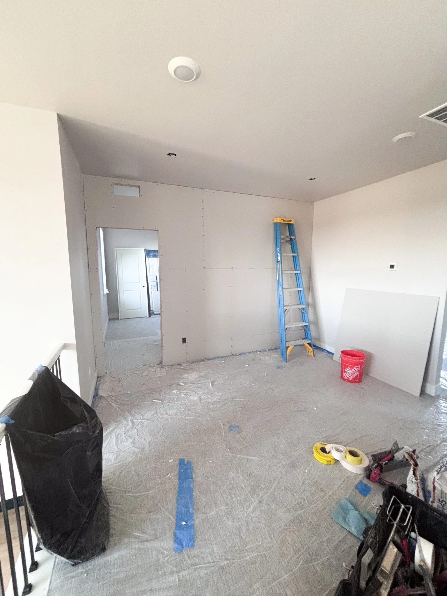 Framed partition wall with doorway dividing loft during bedroom addition in Boise, Idaho