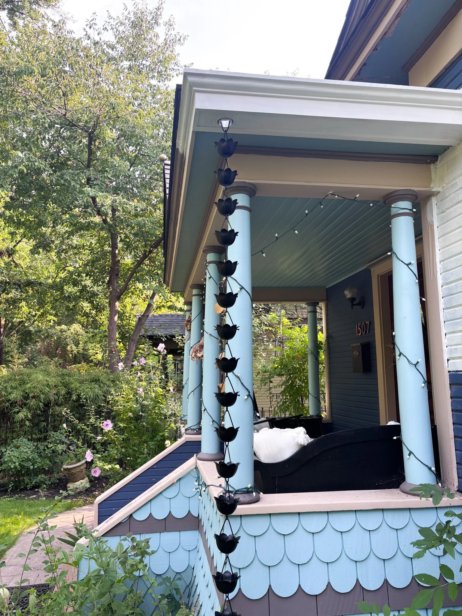Side angle of completed porch with hidden gutter in Garden City, Idaho