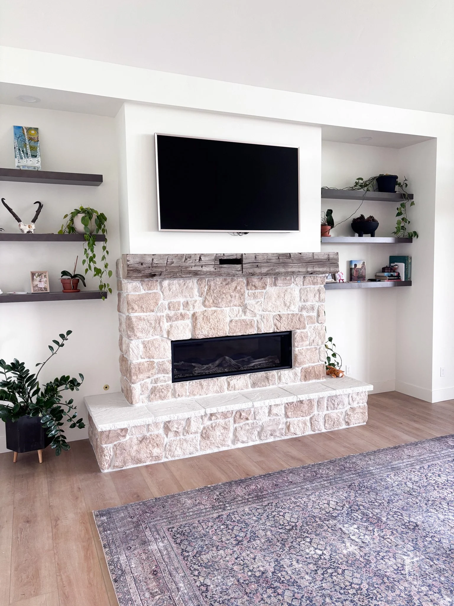 Reclaimed timber beam fireplace mantel installed in a modern Middleton living room