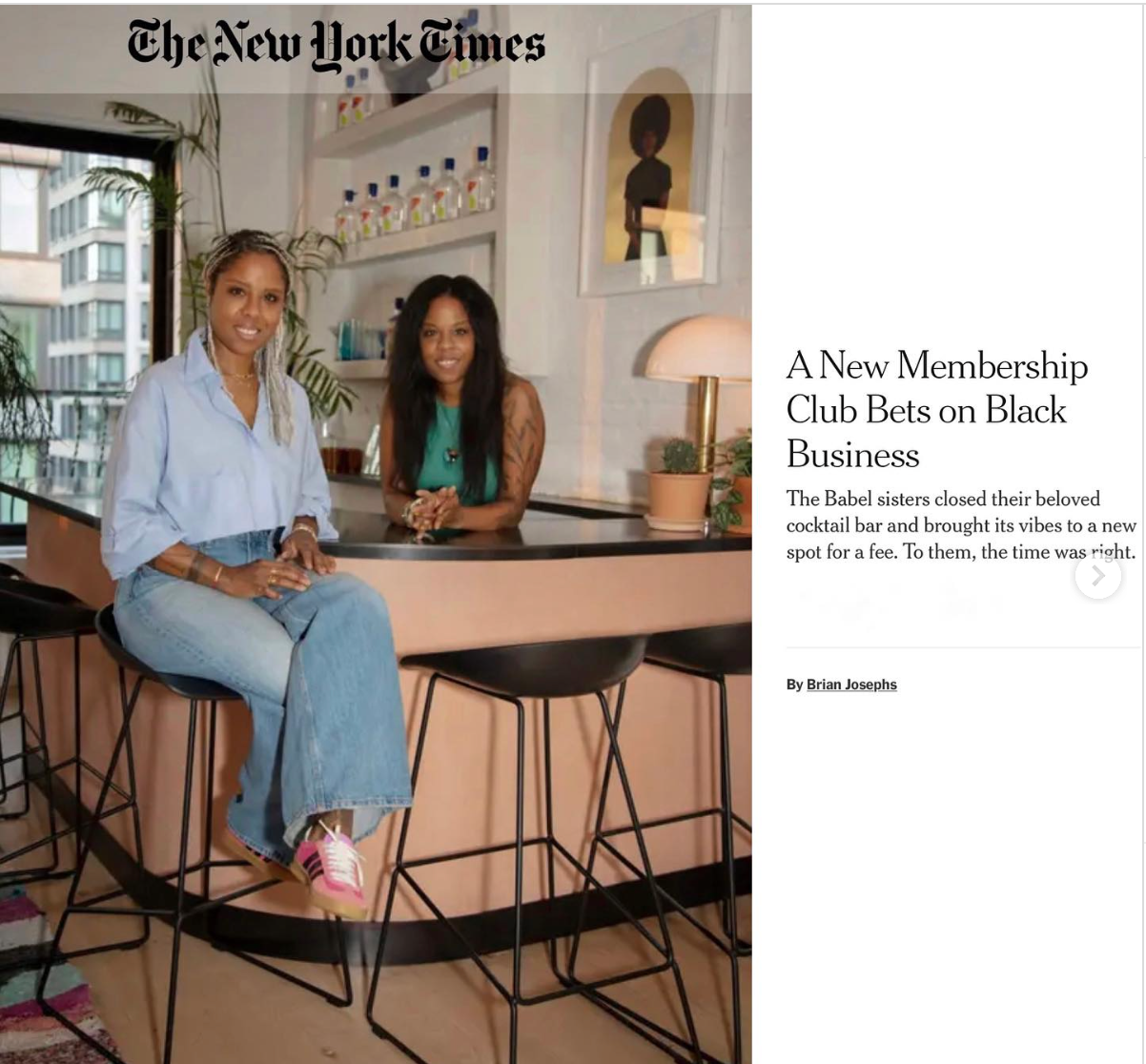 women sitting at a bar counter in a modern interior, with shelves of Babel Gin bottles behind them, and framed artwork on the wall. Sisters entrepreneurs Marva and Myriam Babel; interior design my Marva Babel  