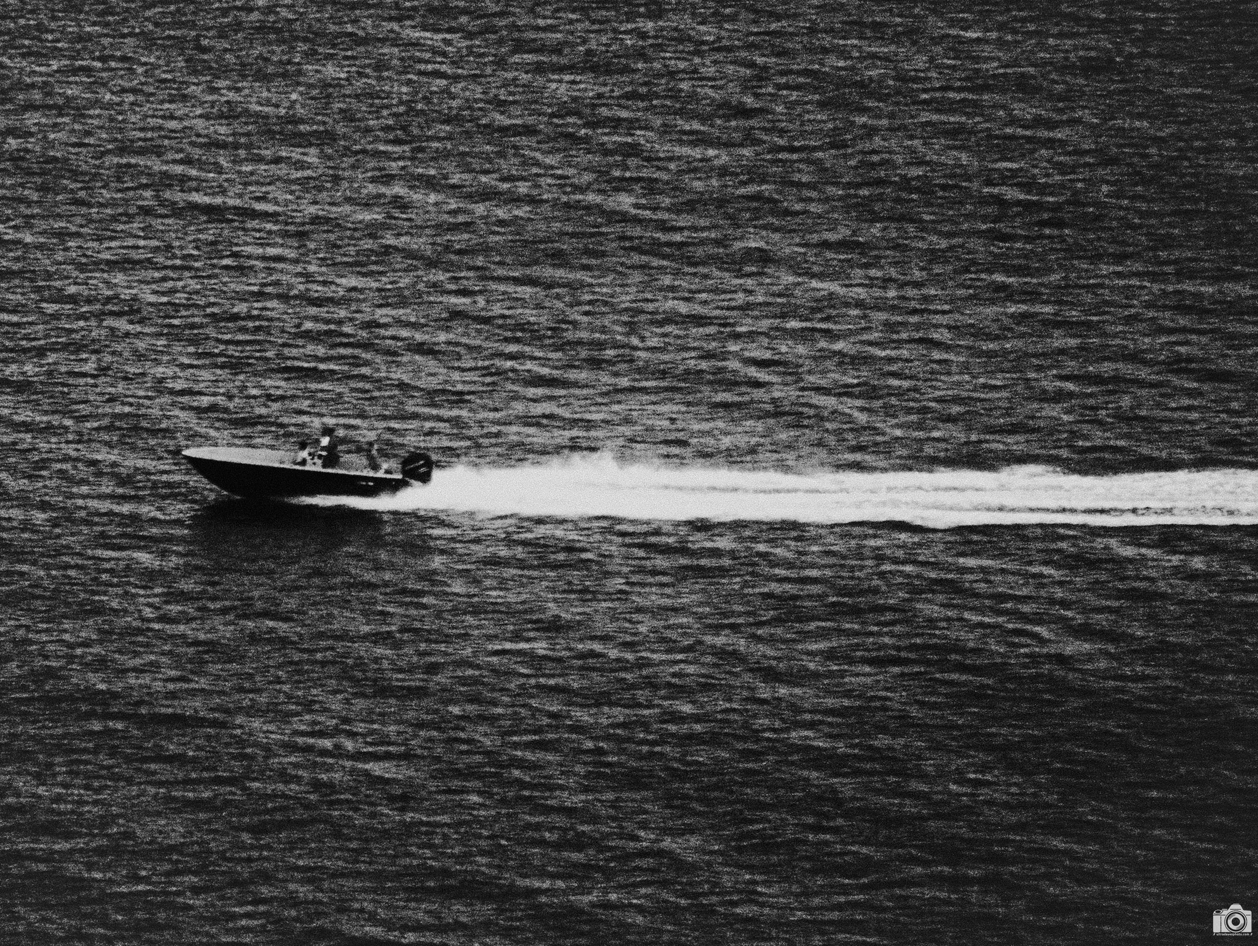 Puerto Rico, USA 2022.  Speed Racer in B&W.  We stayed in a condo community in Aguadilla, which is a town on island's northwestern tip. It’s known for Playa Crash Boat.  Shot taken with a Sony a7c // E 55-210mm OSS @ 315mm - ISO 2500 - f/6.3 - 1/1600