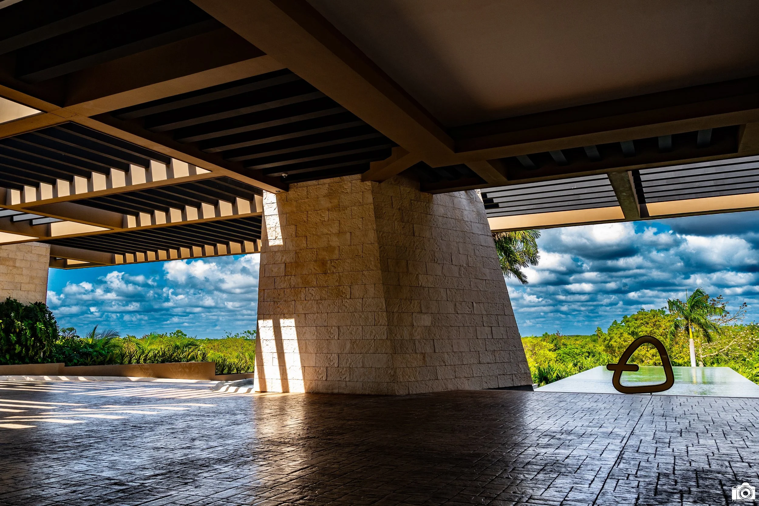 A wider view of the entryway.  The clouds were amazing!

Shot taken with a Sony a7C // FE 28-60mm @ 28mm - F13 - ISO 640 - 1/200s.