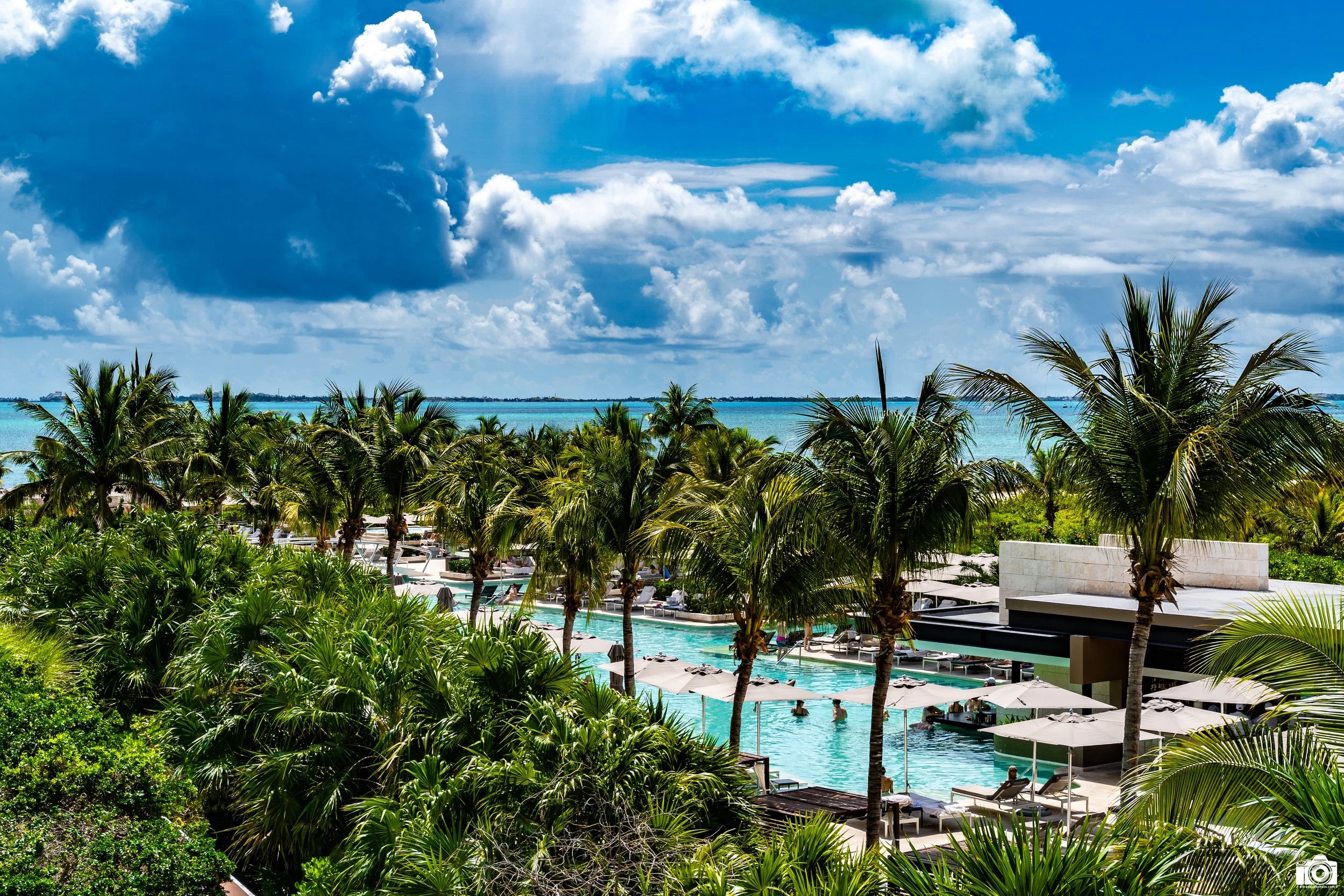 A Room with a Pool View.

The pool goes all the way to the end of the shot with a swim up bar on both ends.  We preferred the bar closest to us with a more chill vibe and lounge tunes.  The other bar was a louder vibe where they held group activities