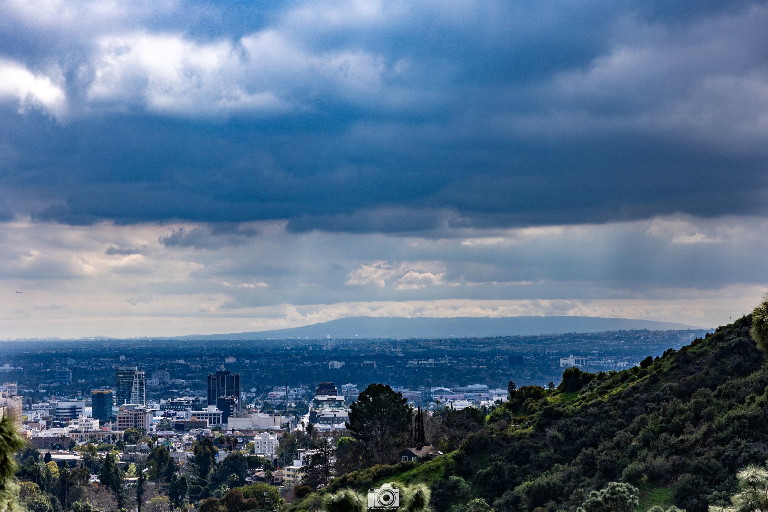 2024 - Dark Clouds Above the City.  LAX is towards the right.  Shot taken with Canon EOS R5 // RF 24-70mm @ 70mm f/2.8 ISO 200 - 1/8000s.