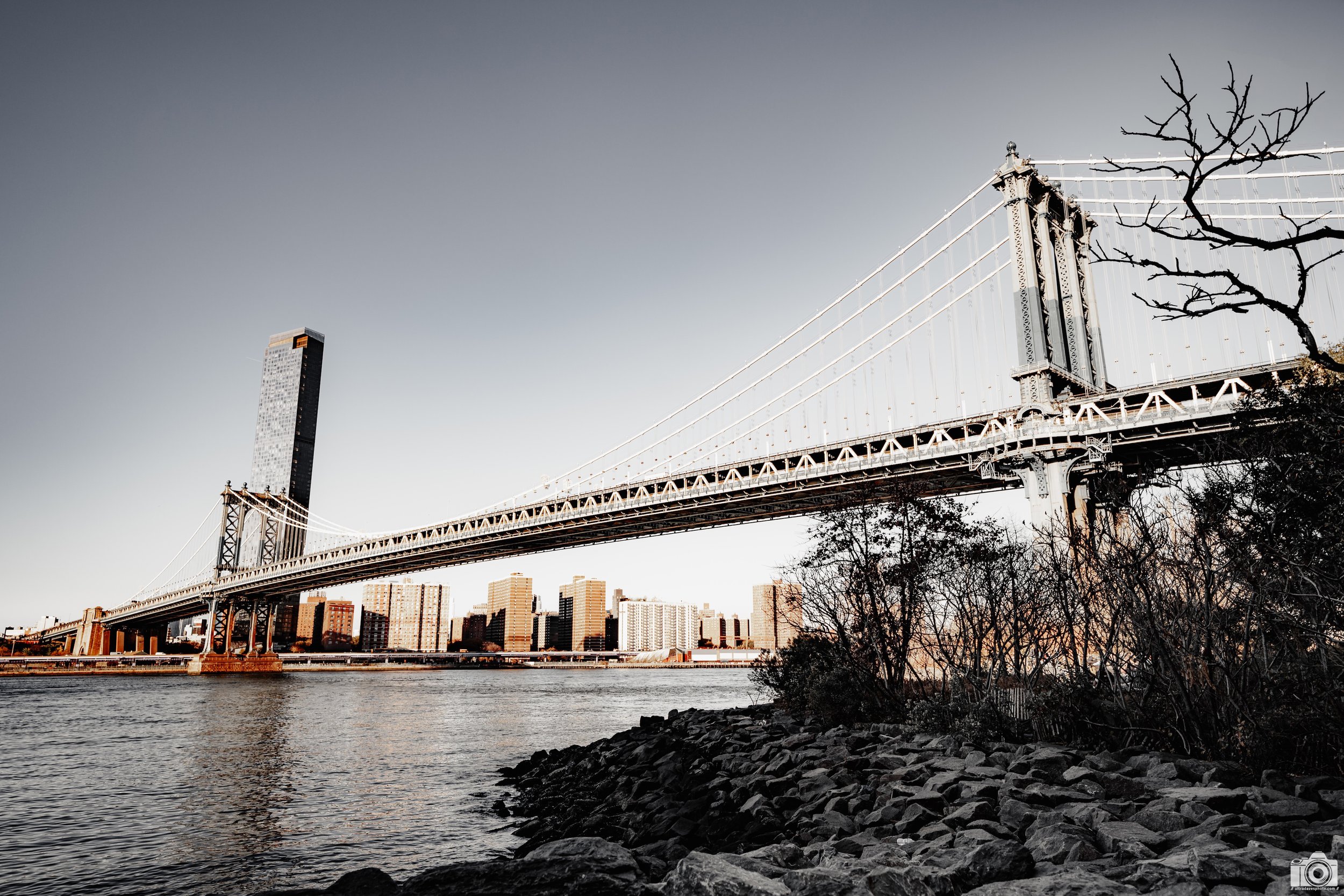 2024 - Manhattan Bridge from Pebble Beach 2.  Shot with a Sony a7c II // FE 12-24mm G @ 24mm f/4 ISO 100 - 1/400s.