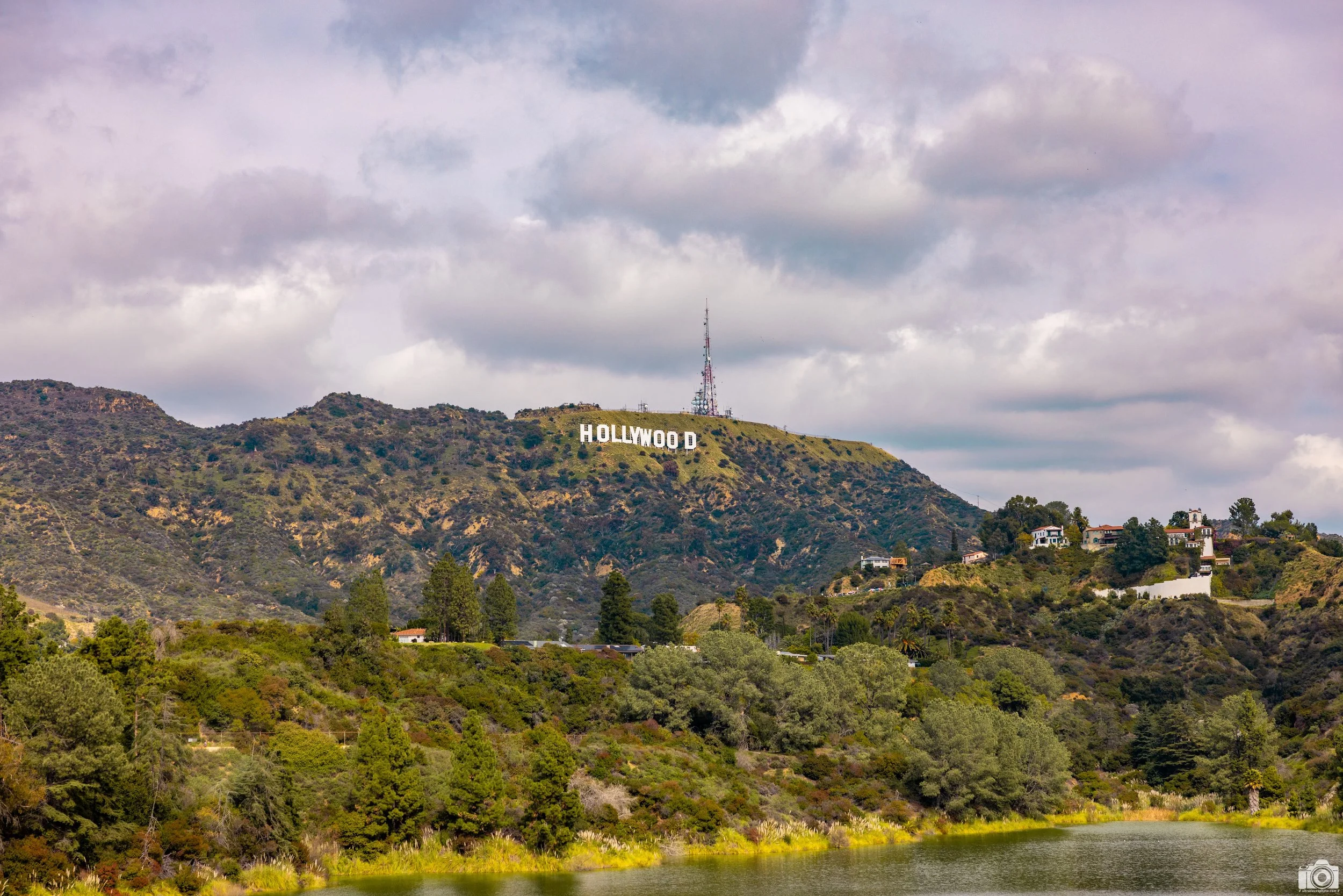 2024 - The Hollywood Sign.  Above the first row of trees by the water you can see the fence where the trail is at.  Shot taken with Canon EOS R5 // RF 24-70mm @ 70mm f/4.5 ISO 125 - 1/1600s.