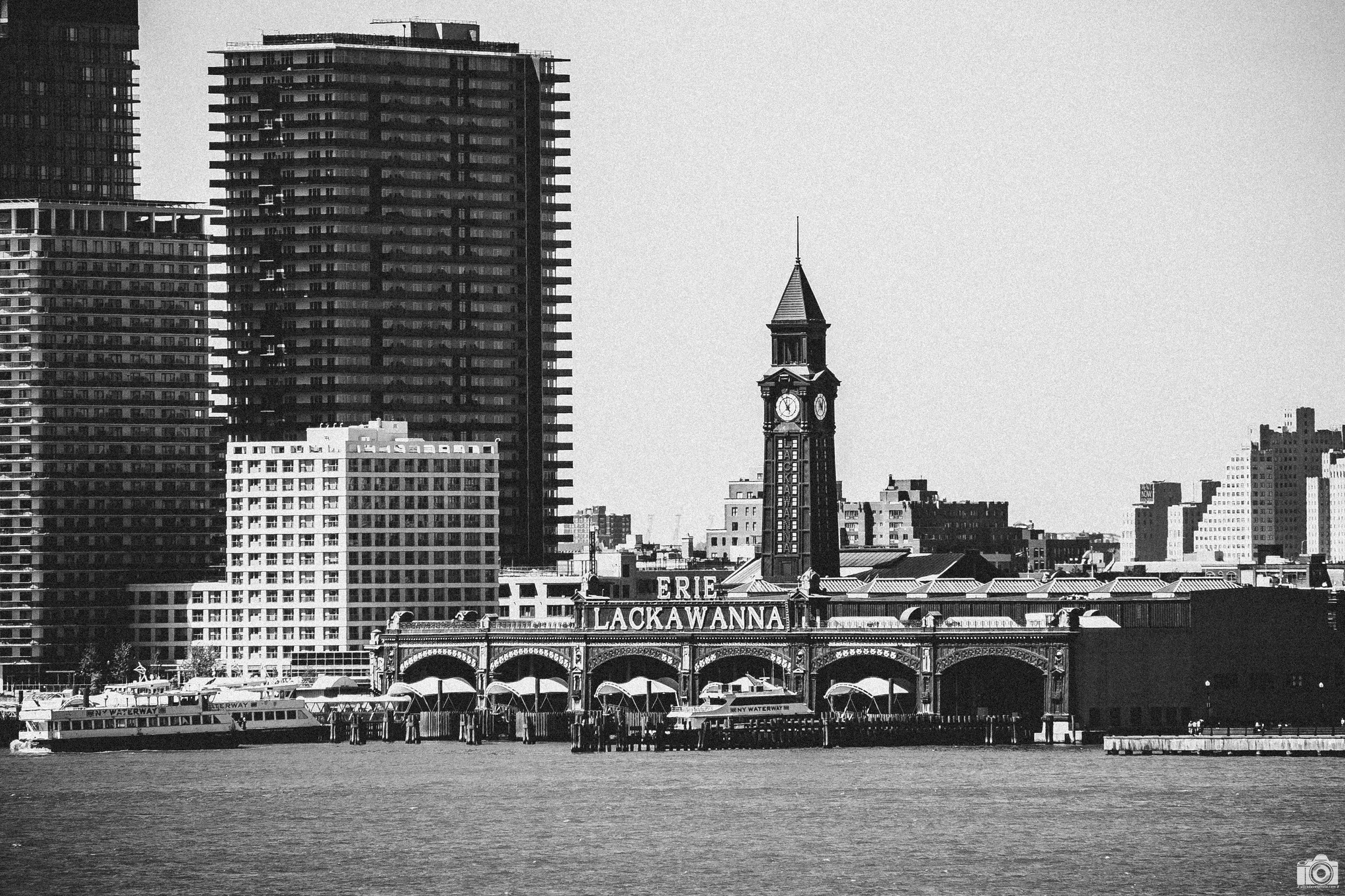 New York 2025.  Erie-Lackawanna Park in B&W - Zoomed in.  Shot across the Hudson near Pier 46 with a Sony a7c // Tamron E 18-300mm @ 262mm - ISO 125 - f/6.3 - 1/640s.