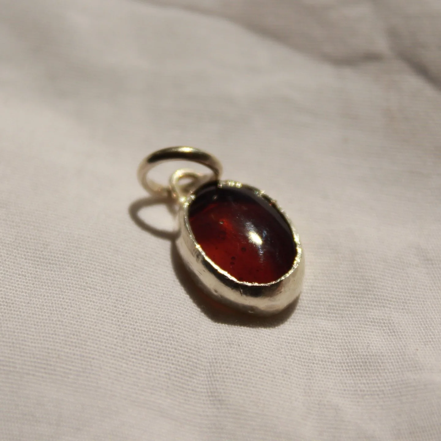 this stone is so hard to capture the true shade, sort of a watered down ribena (not my preferred level) but also features these really pretty stripes through the gem #purple #silver #jewellery #pendant