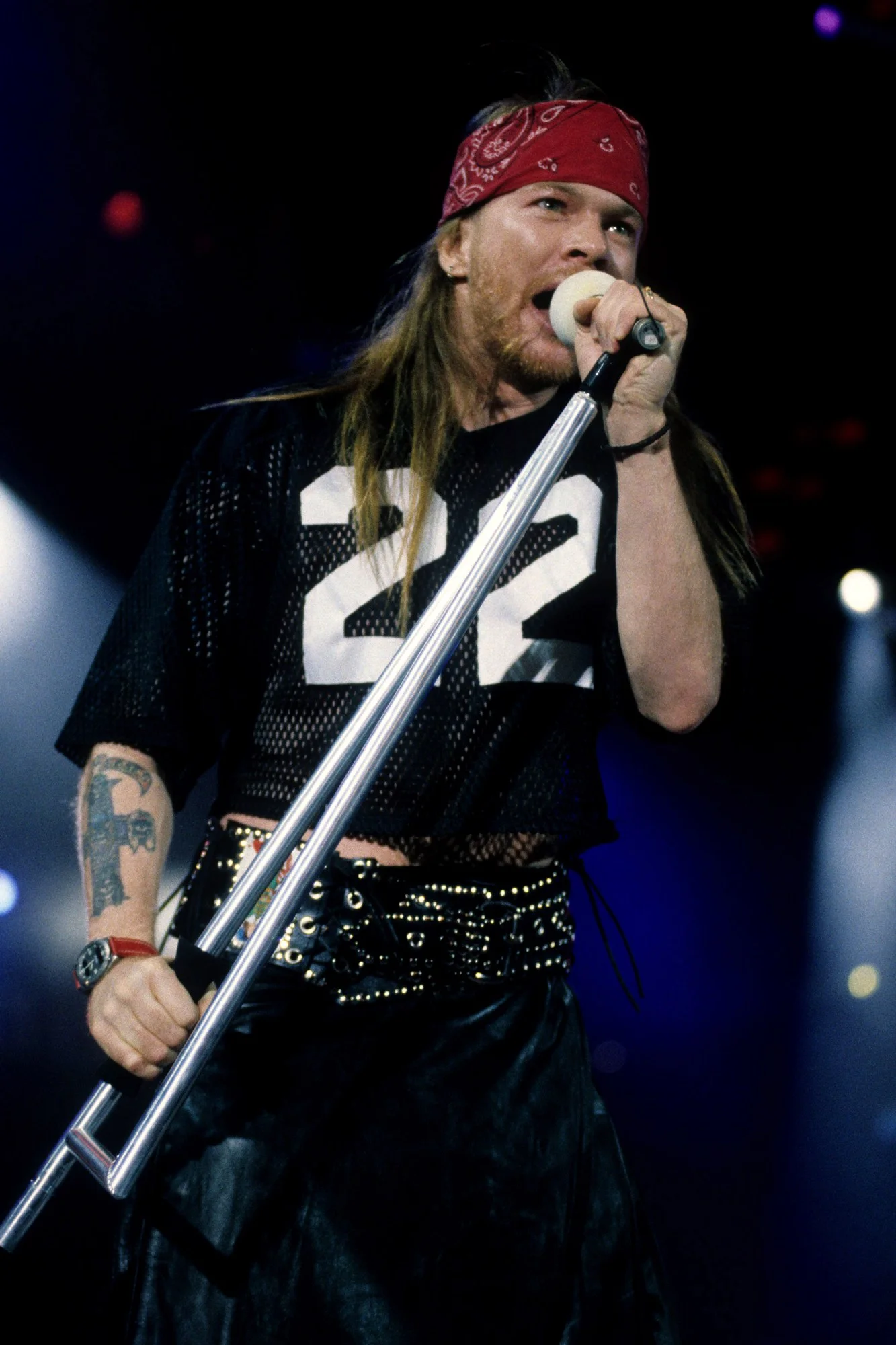 “On the screen, Axl Rose silently hopped across the stage in his bandana and cutoff shirt.”