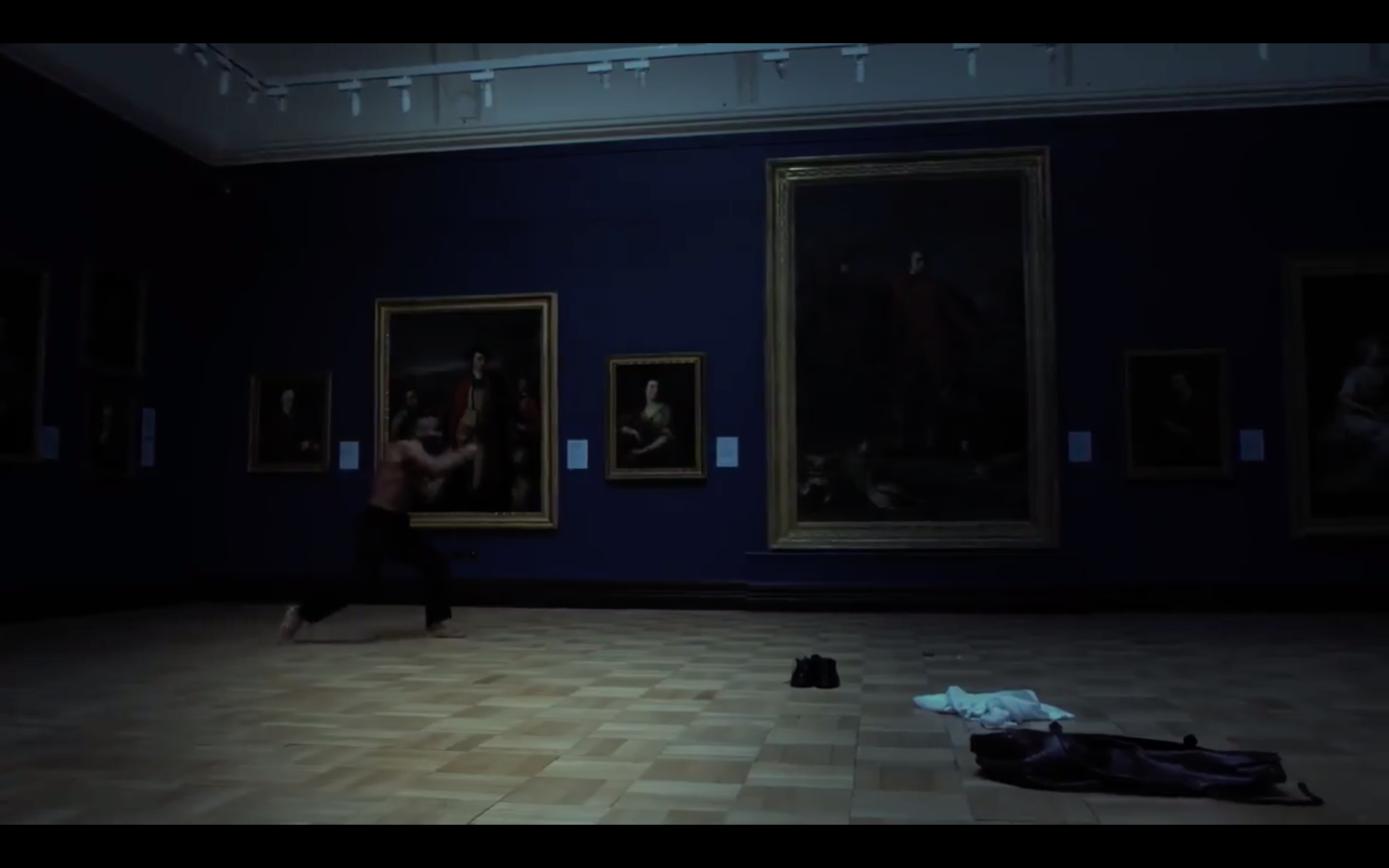 “He removes his shirt and begins to shadowbox with the paintings of Scottish national figures.”