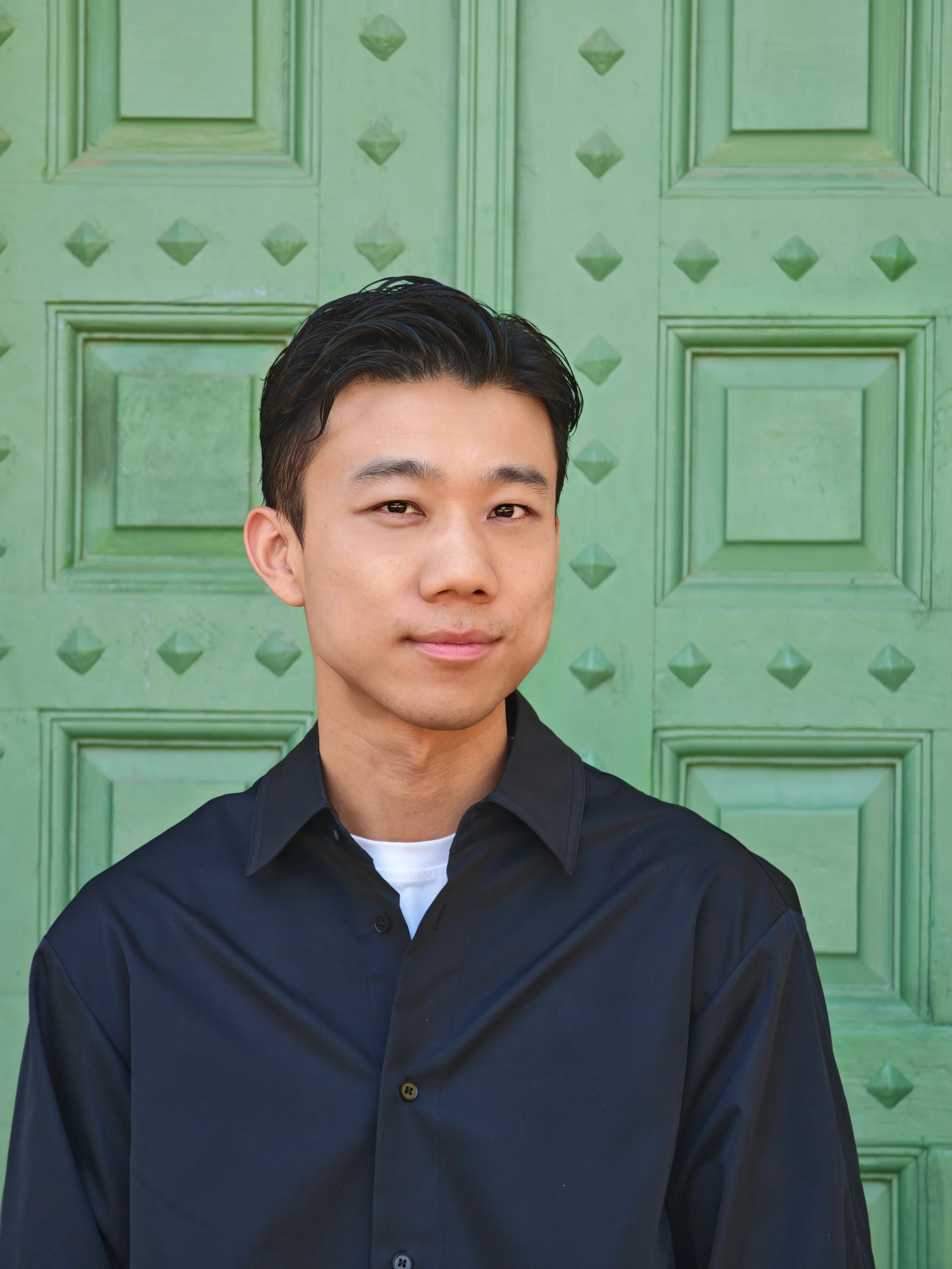 Headshot of author Zhenglong Yang