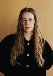 Headshot of author AM AM