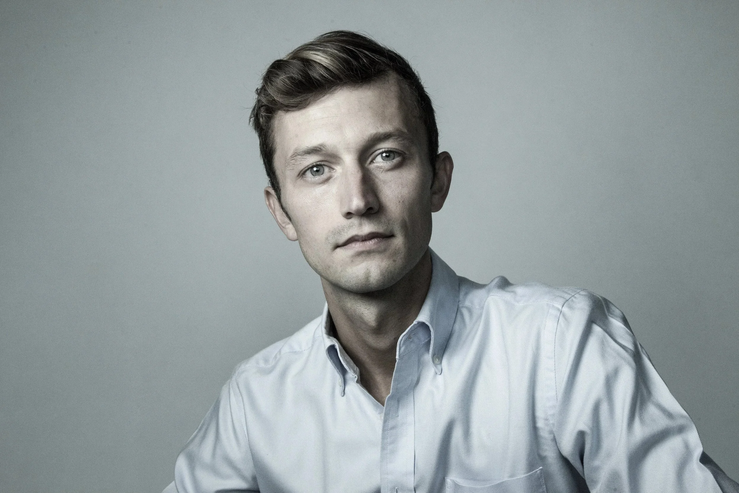 Headshot of author Adam Falkner