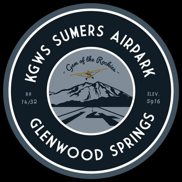 Badge for KGW's Sumers Airport in Glenwood Springs with mountain, airplane, and runway illustration, and the slogan 'Gem of the Rockies'.