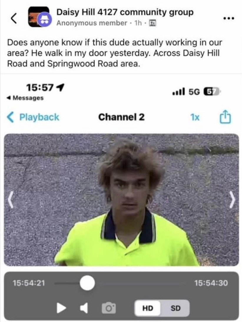 A screenshot of a social media post showing a man with messy hair wearing a yellow shirt, seemingly caught on camera, on a video playback screen. The post is from Daisy Hill 4127 community group asking if anyone knows this person working in the area around Daisy Hill Road and Springwood Road.