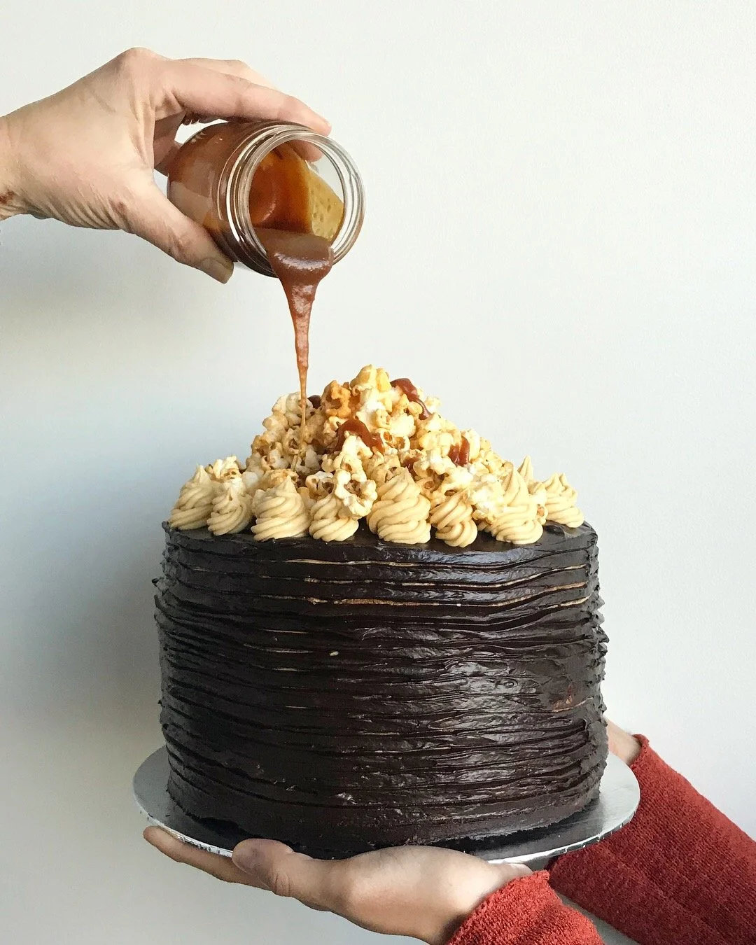 salted caramel and chocolate popcorn layer cake