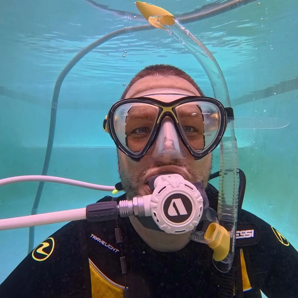 Divemaster trainee in the pool for PADI rescue course.
