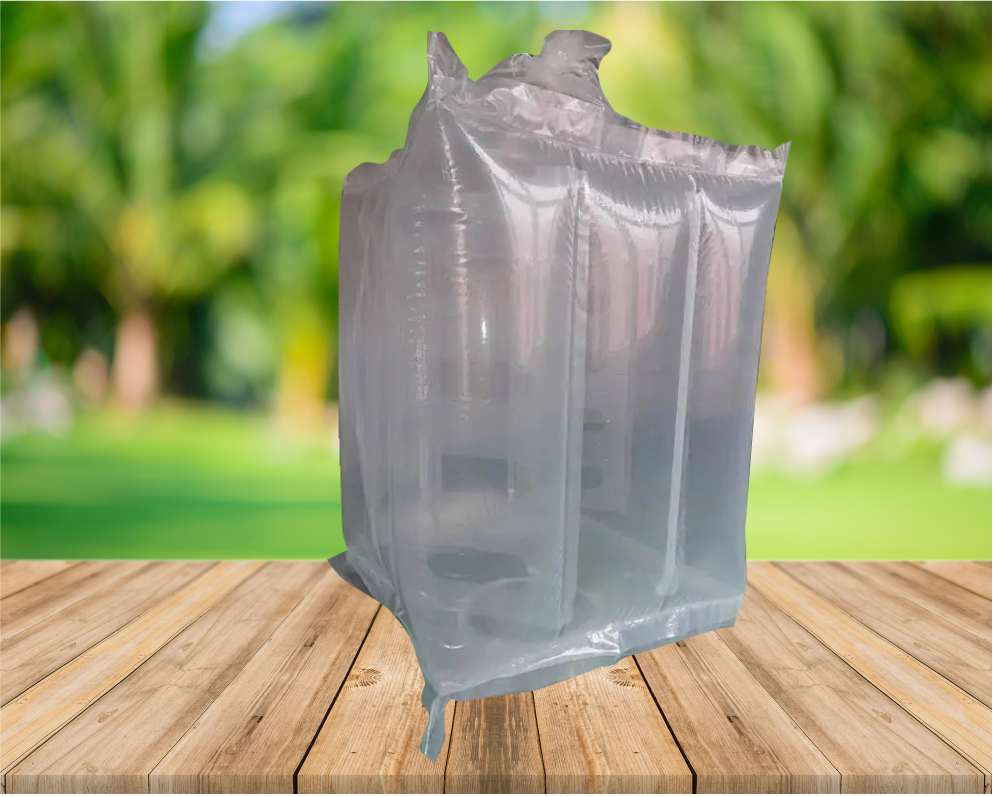 A transparent plastic bag or cover placed over a small table or shelf with glass bottles inside, outdoors on a wooden surface with greenery in the background.