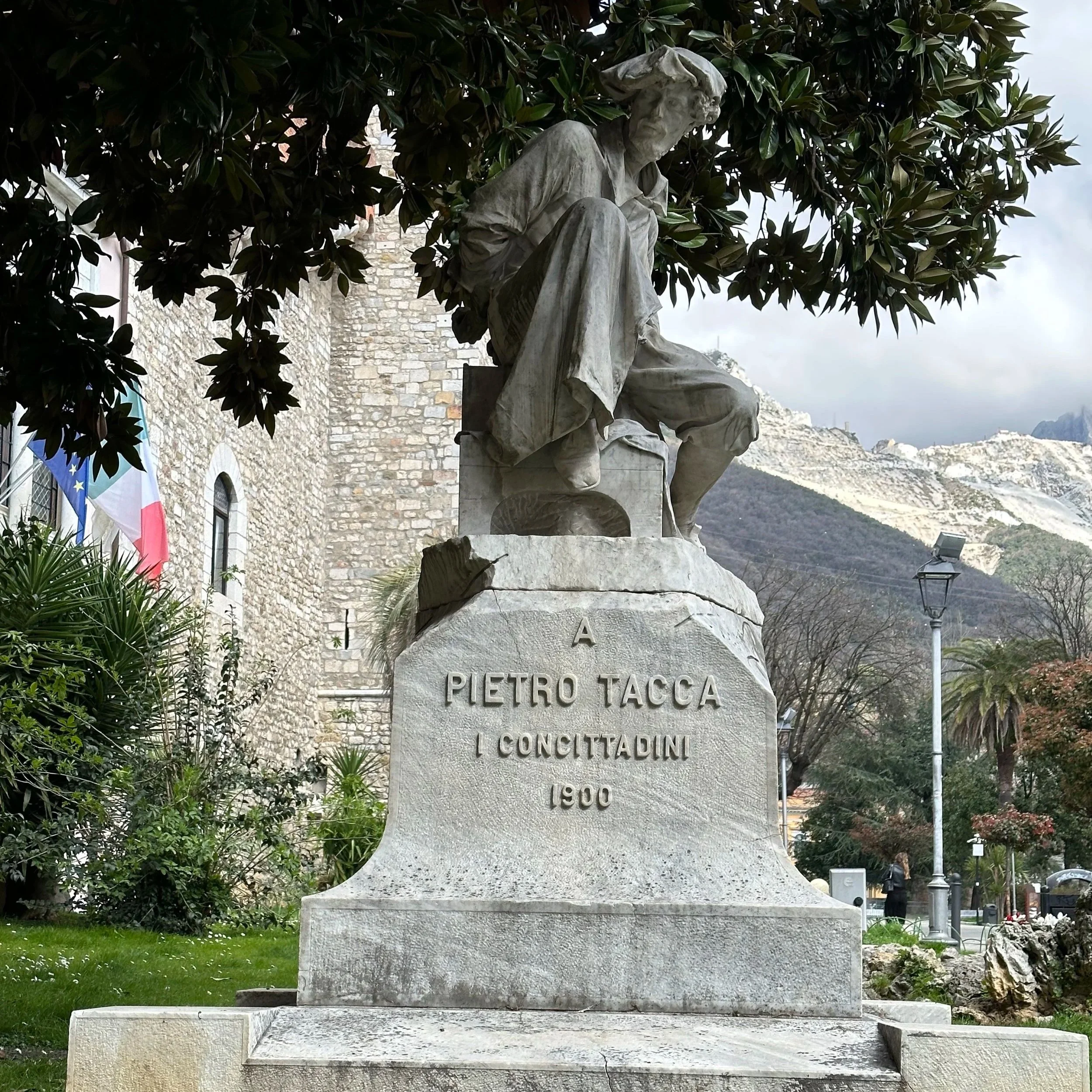 Monumento a Pietro Tacca by Carlo Fontana (1900) in Piazza Accademia, Carrara, beside the Academy of Fine Arts in Tuscany, Italy