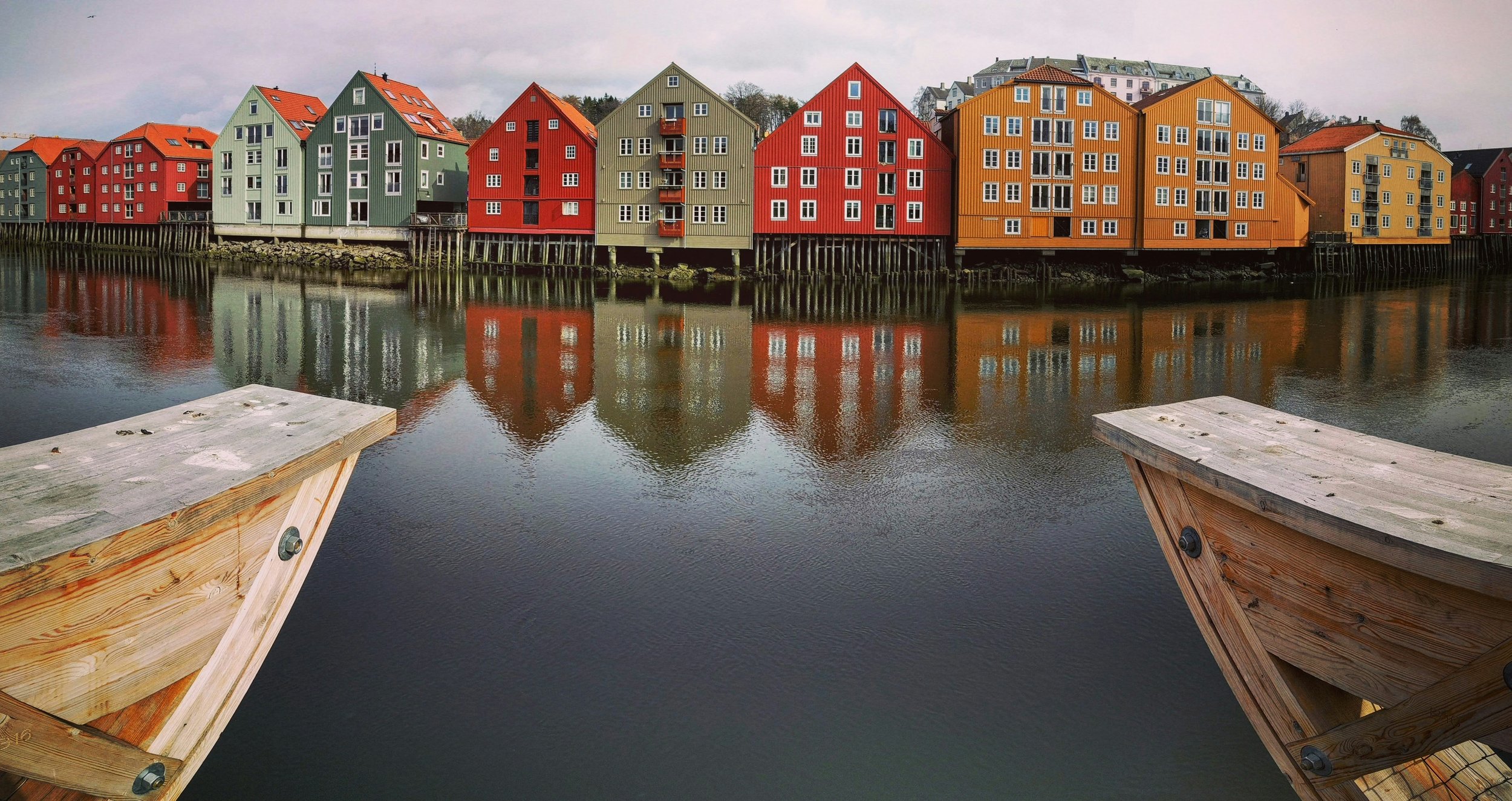 Travel Lifestyle Culture Trondheim, Norway at dawn, historic wooden wharves on the Trondheimsfjord near Nidaros Cathedral