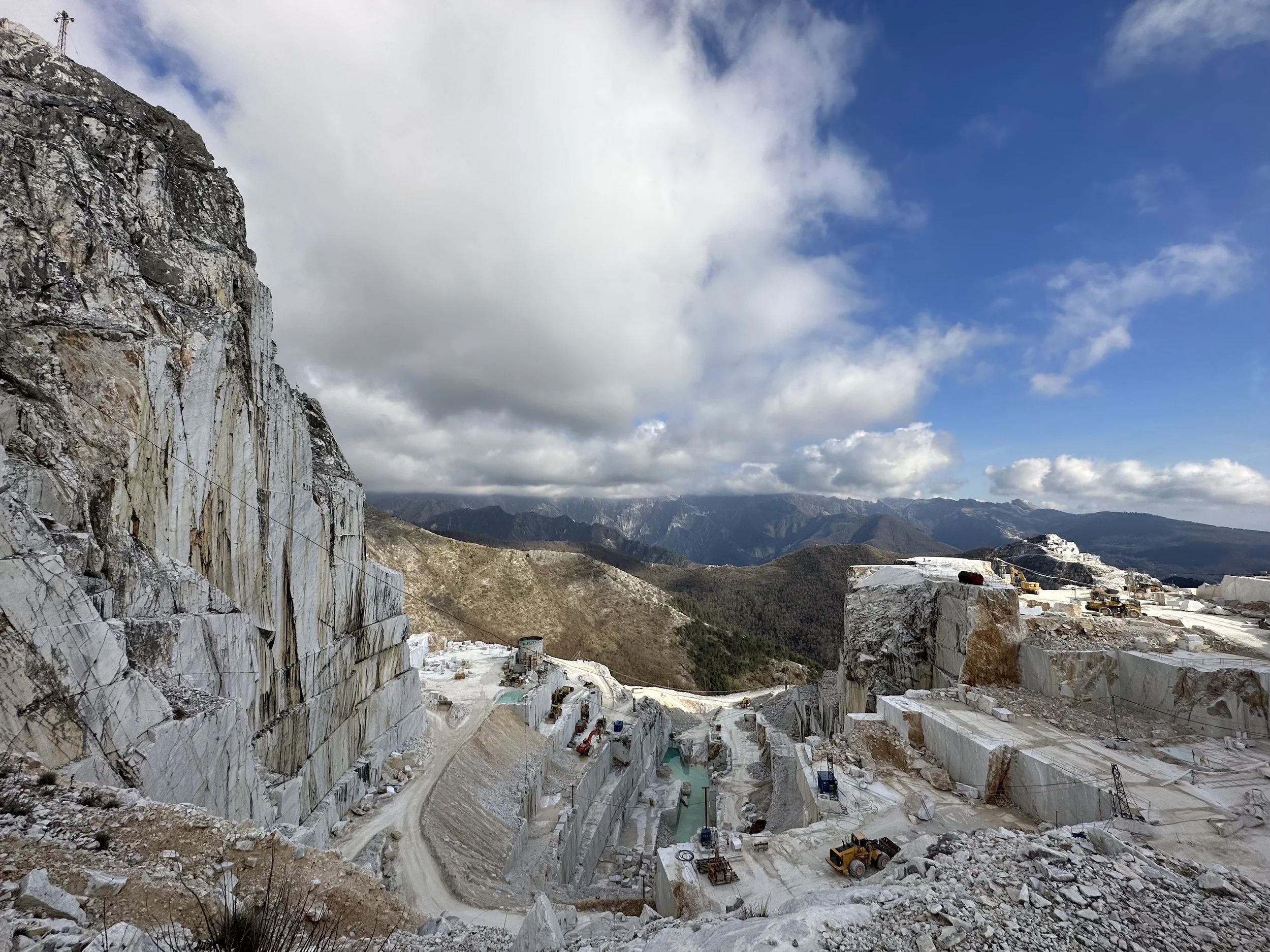 Panoramic view of Carrara marble quarries and city in the Apuan Alps, Tuscany, Italy’s renowned white marble capital top view goals italy view from the top